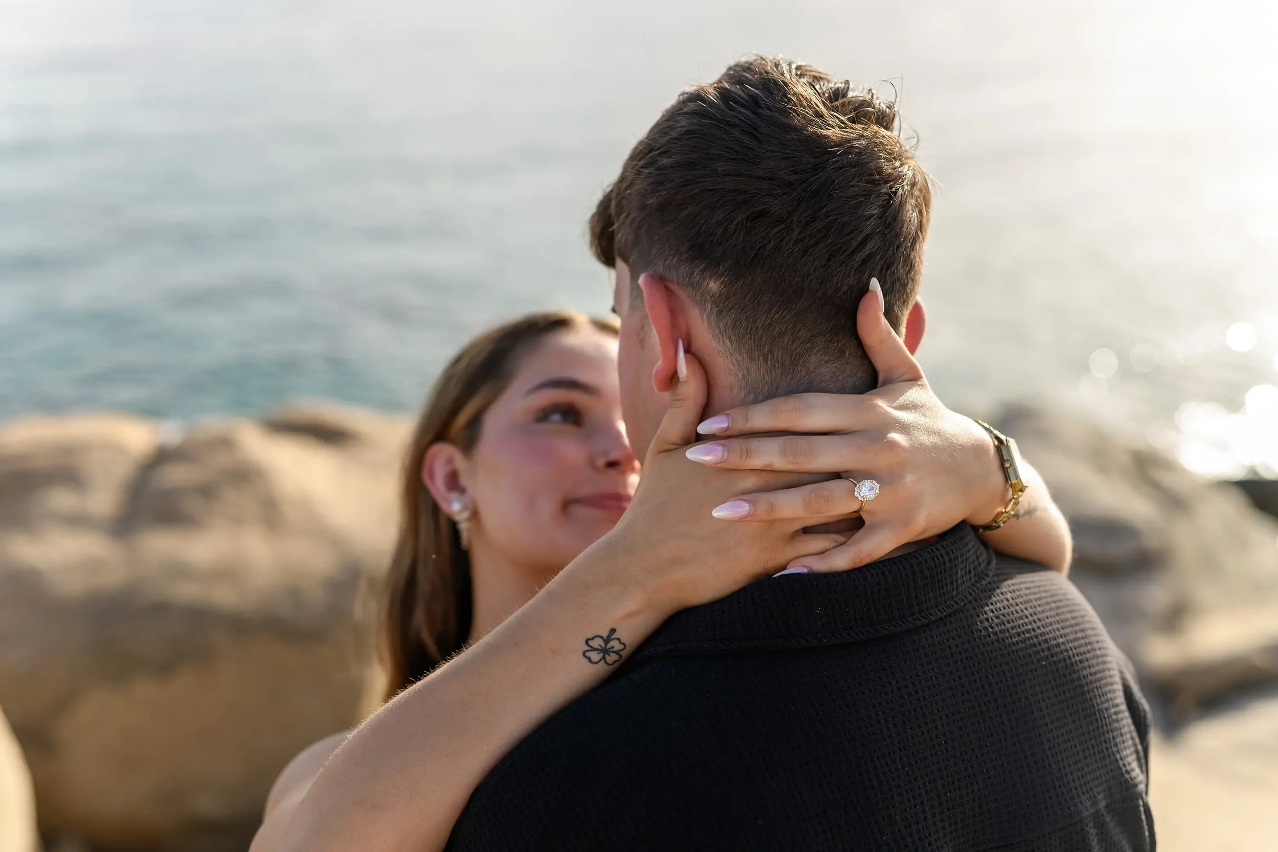 Romantic engagement photography in Naxos, Greece, captured by Naxos Photographer, Spyros Plakidas, with the proposal ring and Aegean Sea in the background.
