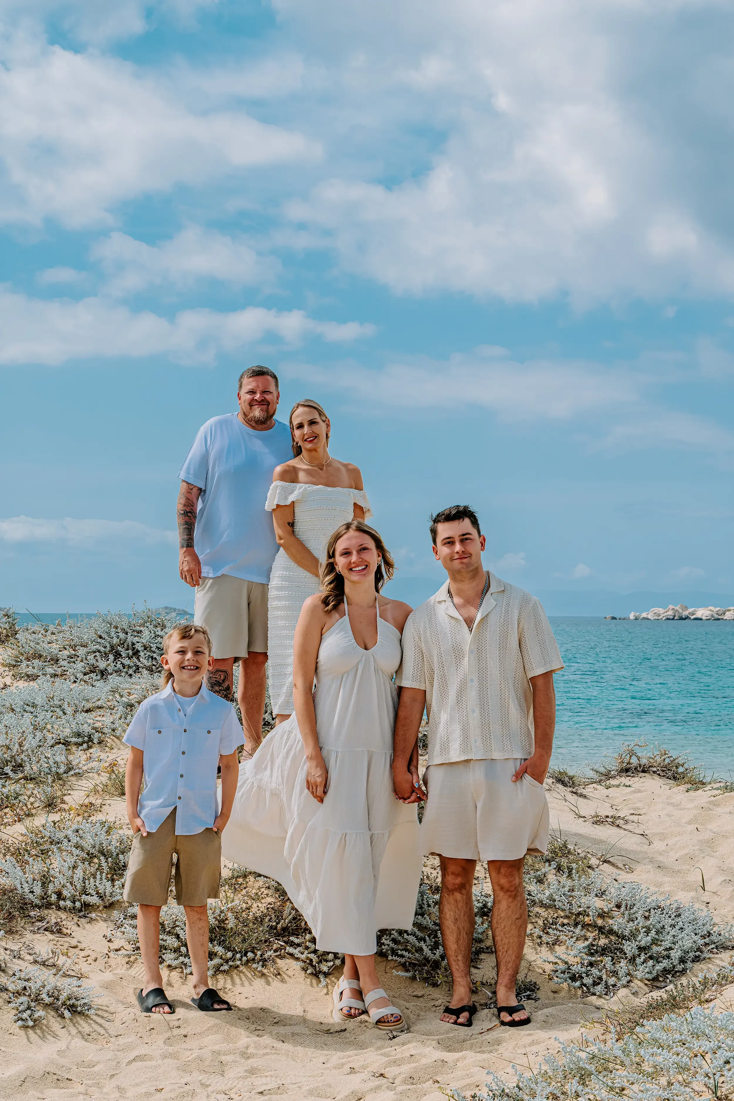 Family beach photoshoot in Naxos, Greece, captured by Naxos Photographer, Spyros Plakidas, during a relaxed vacation photography session by the Aegean Sea.
