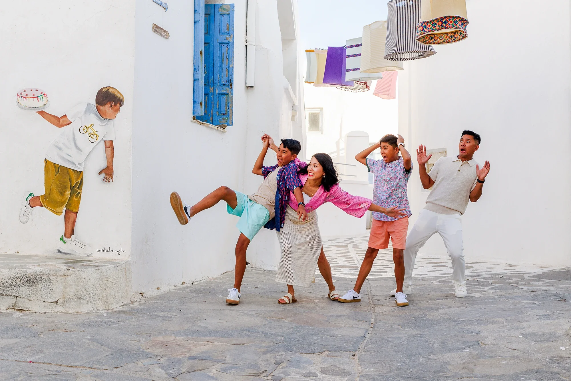 Family having fun during a playful photoshoot in Naxos Old Town