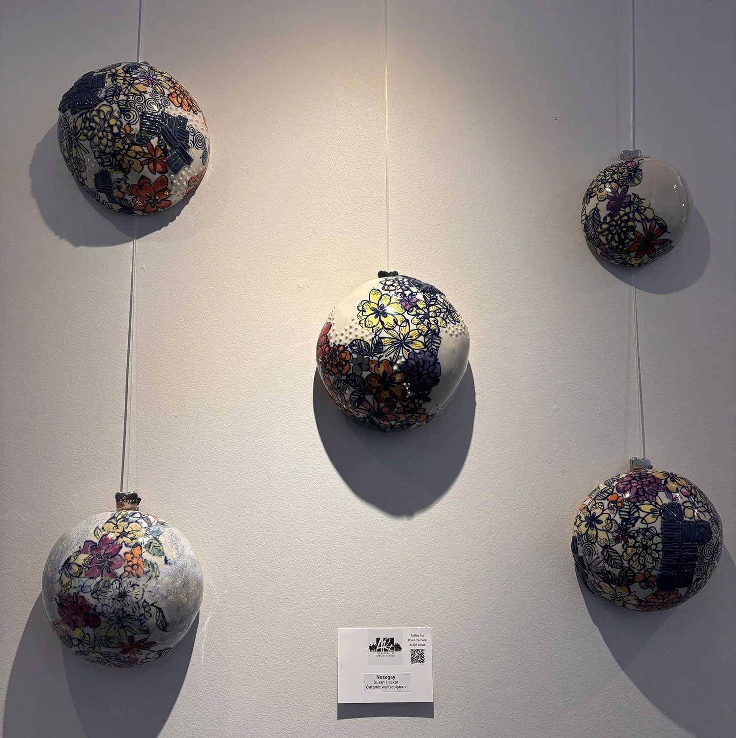 "Nosegay" by Susan Hacker.  Ceramic wall sculpture.  $450.