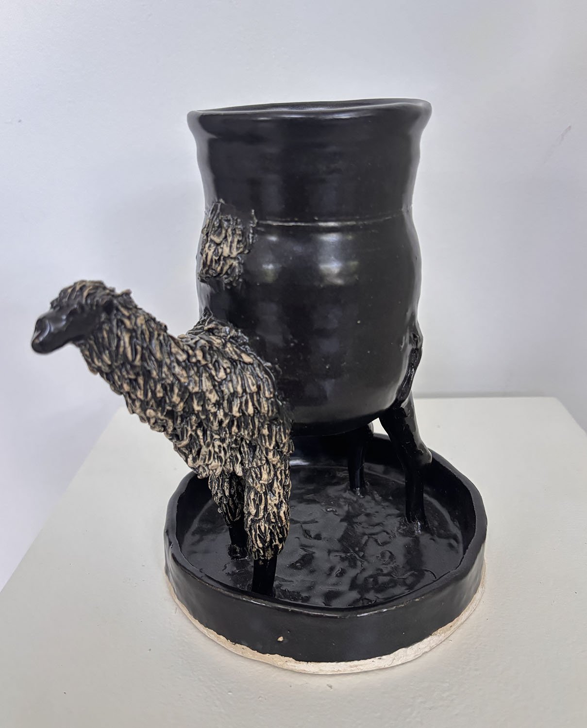 "Llama Vase" by Mary Curtis of Babes of Mud & Fire. Hand sculpted, high fired
Stoneware with glaze.  $200.