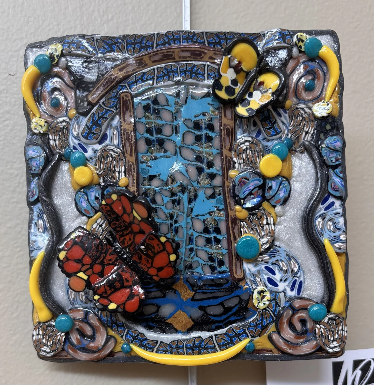 Butterfly Window Number 7,
Marina Lostetter.
Polymer Clay Tin and Paper,
5.5” x 5.5”,



$65 (wall hanging).
