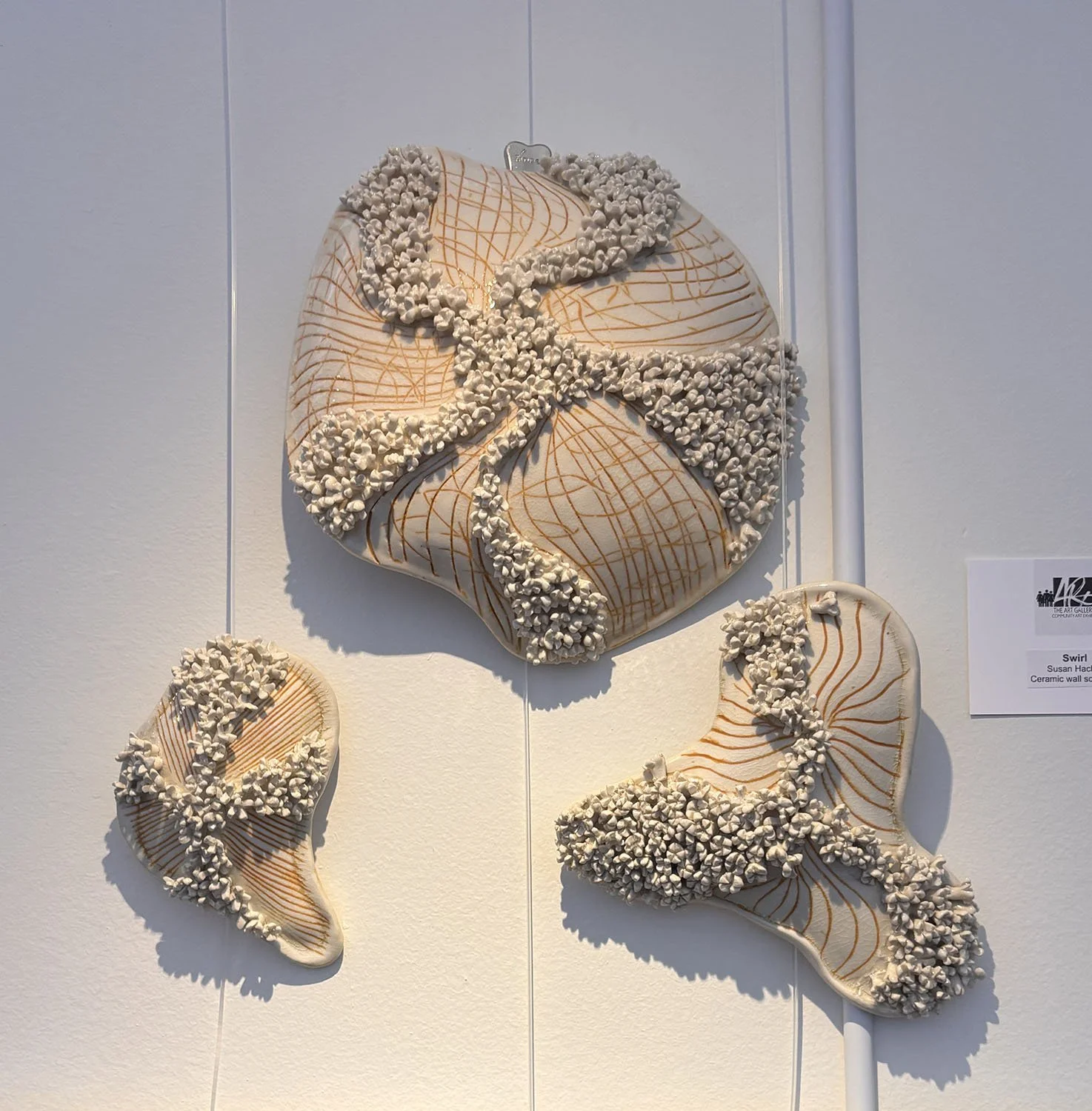 "Swirl" by Susan Hacker.  Ceramic wall sculpture.  $325.