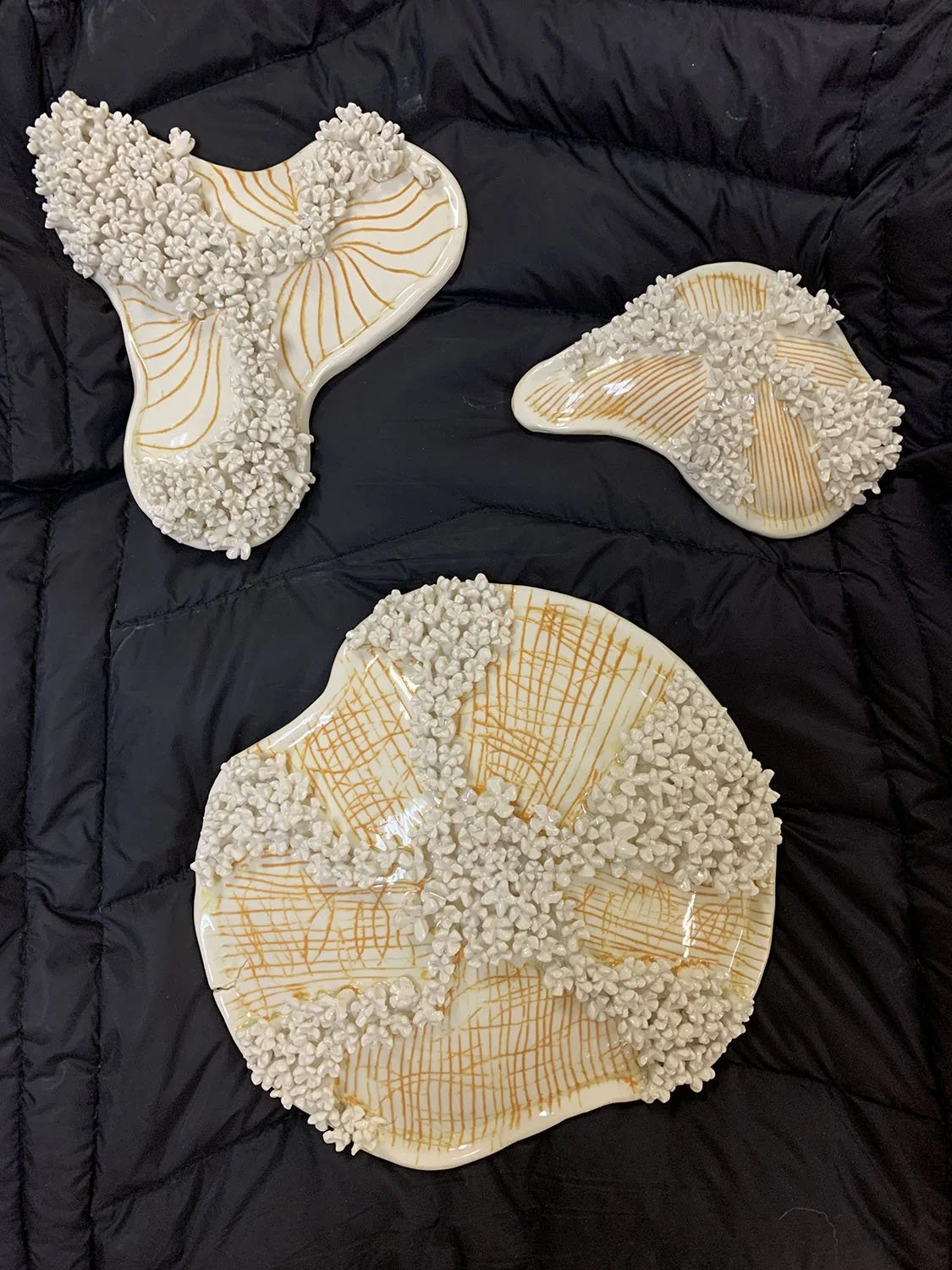 Swirl,
created by Susan Hacker,
3 piece ceramic sculpture,
11” x 14”,
$325.00