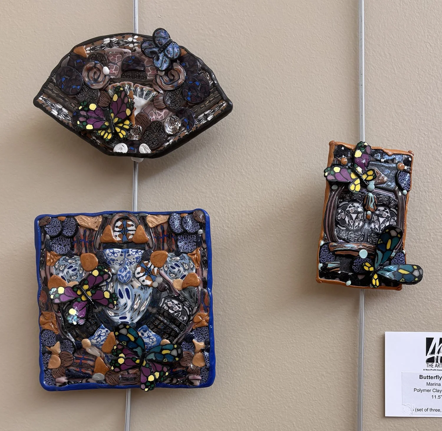 Butterfly Windows,
Marina Lostetter.
Polymer Clay Tin and Paper,
11.5”  x 11”,

 $145 (set of three, #16, #17A, & #17B).
