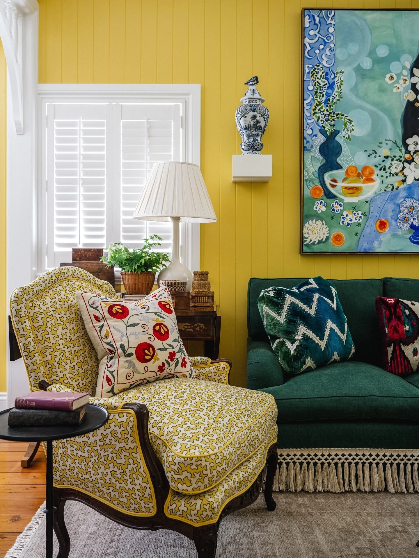 Our cheery living room at home, crammed full of bits and pieces we&rsquo;ve found along our way. 
The suzani cushion we found at the Grand Bazaar in  Instanbul, many years ago.
The delft vases on the brackets are 18th century and found on @1stdibs.

