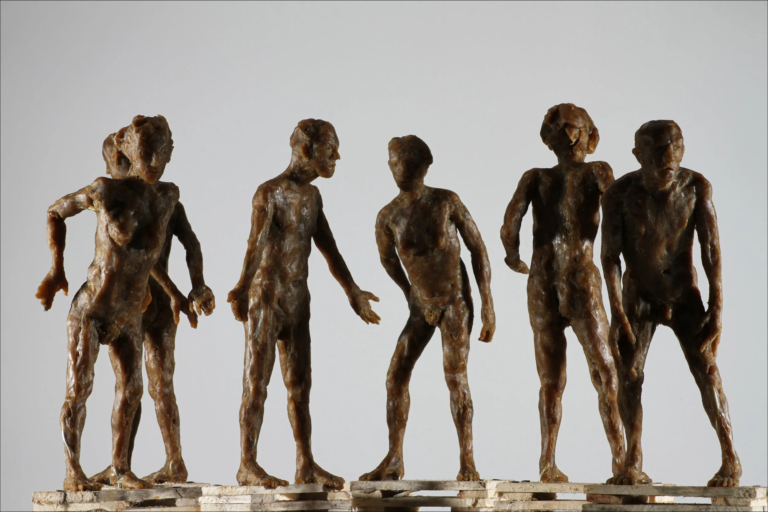 Six Figures  (2025), microcrystalline wax, wood bases; height: 15 ½ inches, width and depth variable