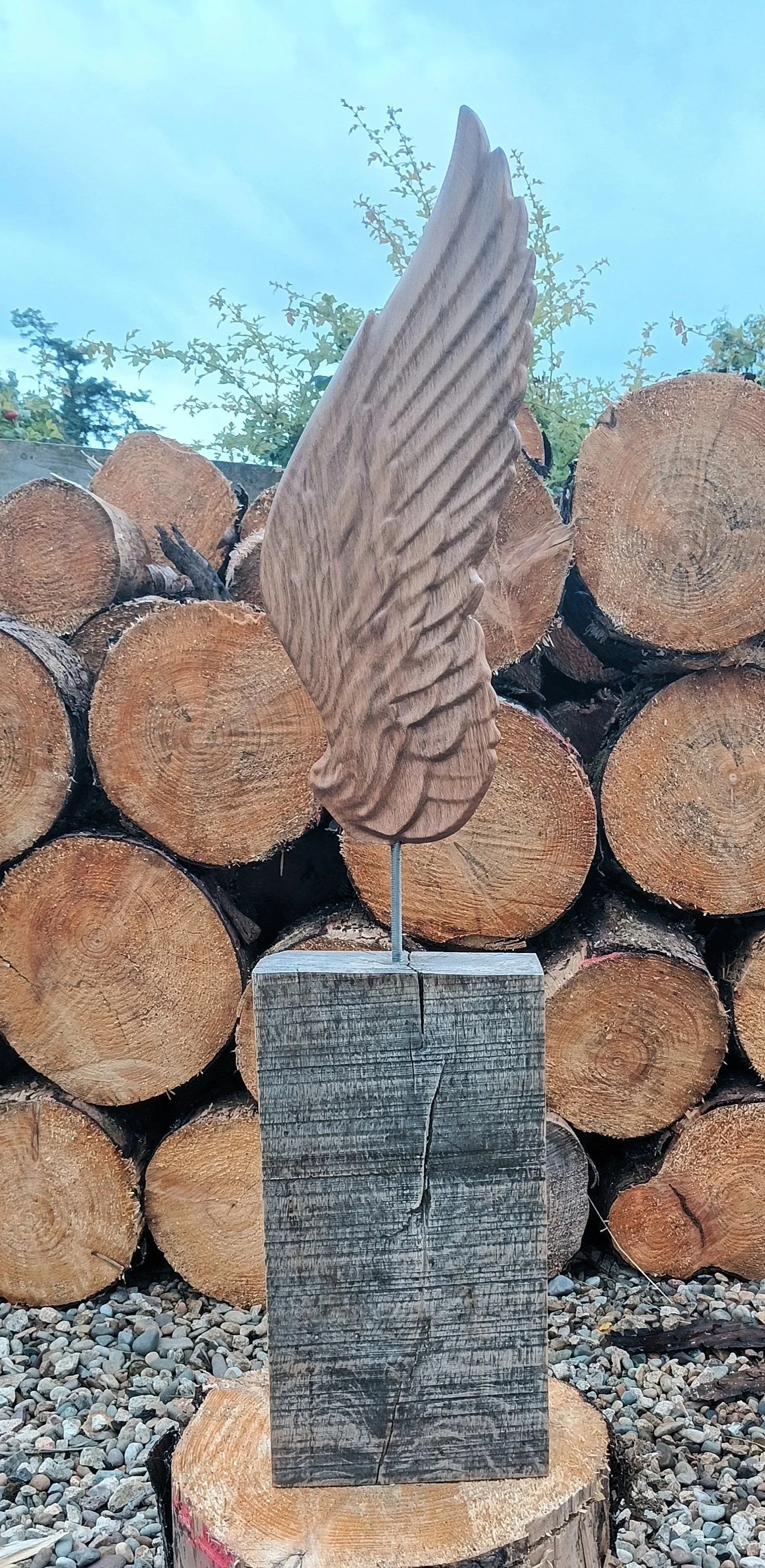 double sided carved angel wing , outdoor sculpture 