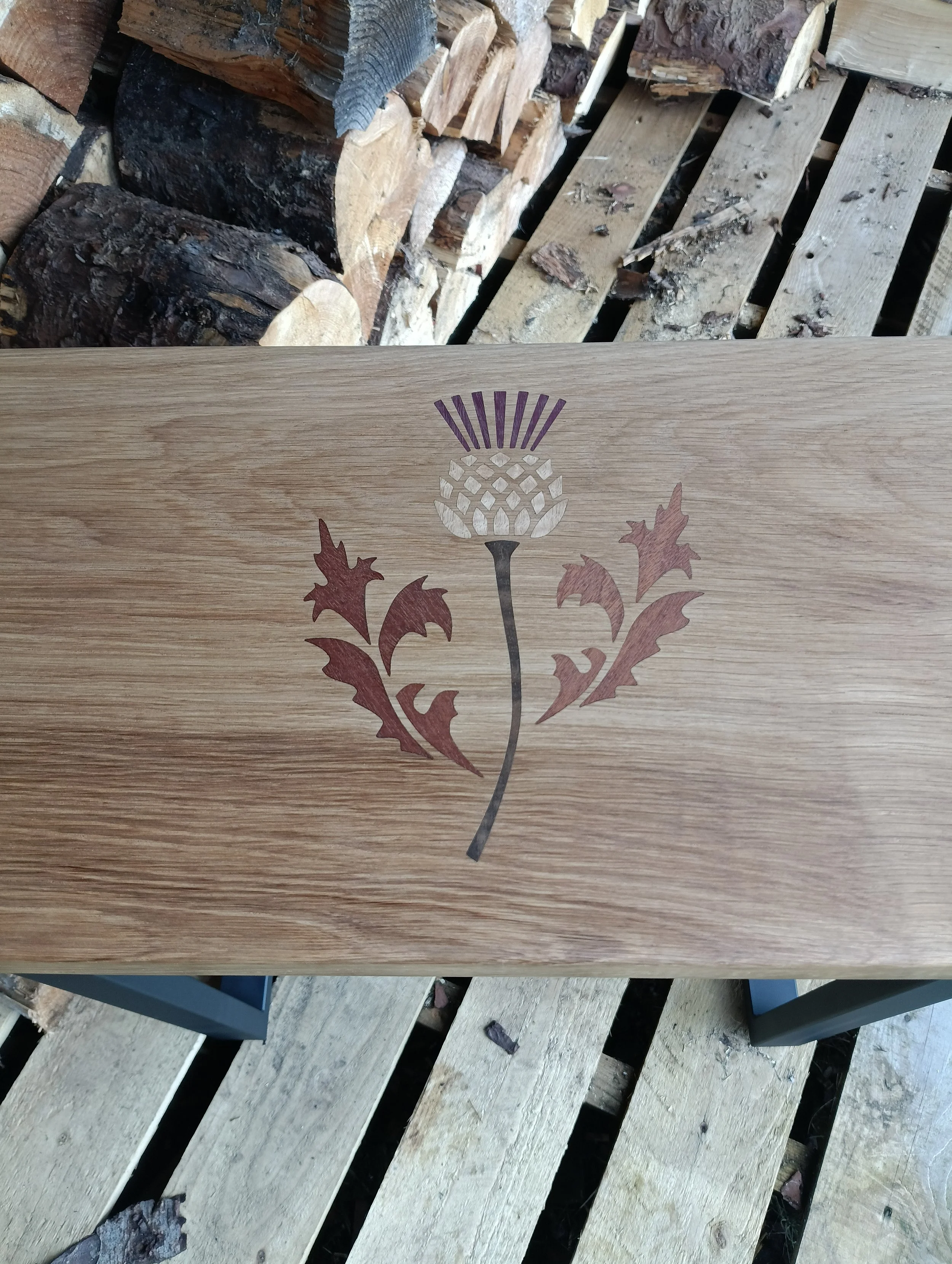 A Scottish Marquetry piece done with purple heart , eucalyptus  , fumed eucalyptus  , and sapele on solid Oak hall table