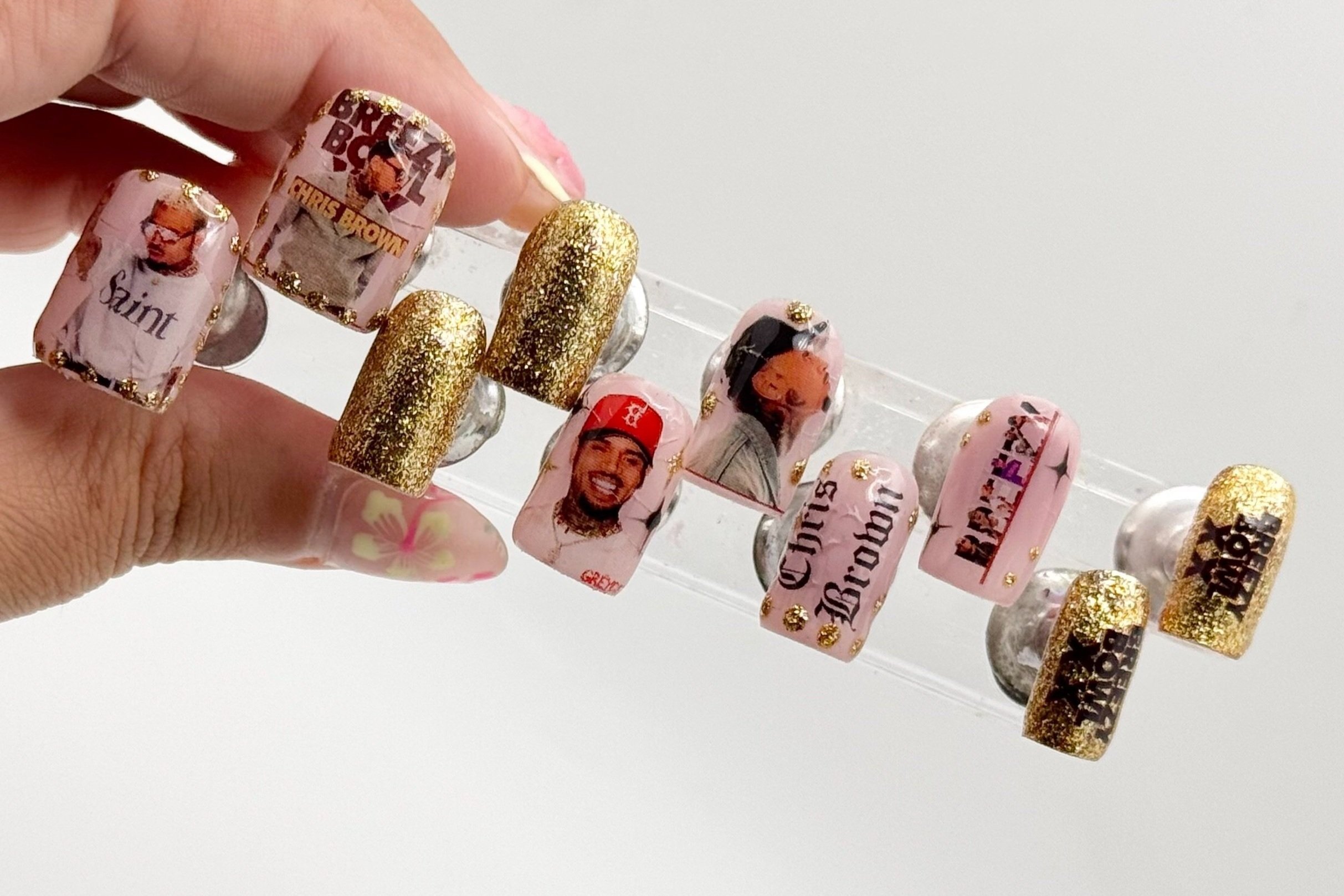 Close-up of Breezy Bowl XX World Tour–inspired press-on nails featuring Chris Brown–themed designs