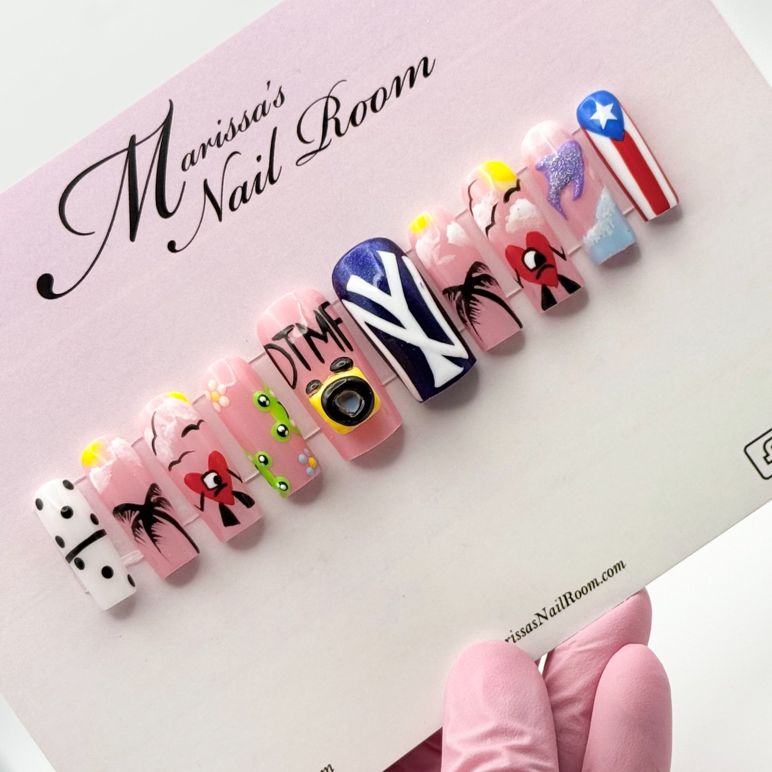 Press-on nails Bad Bunny DTMF 3D art displayed