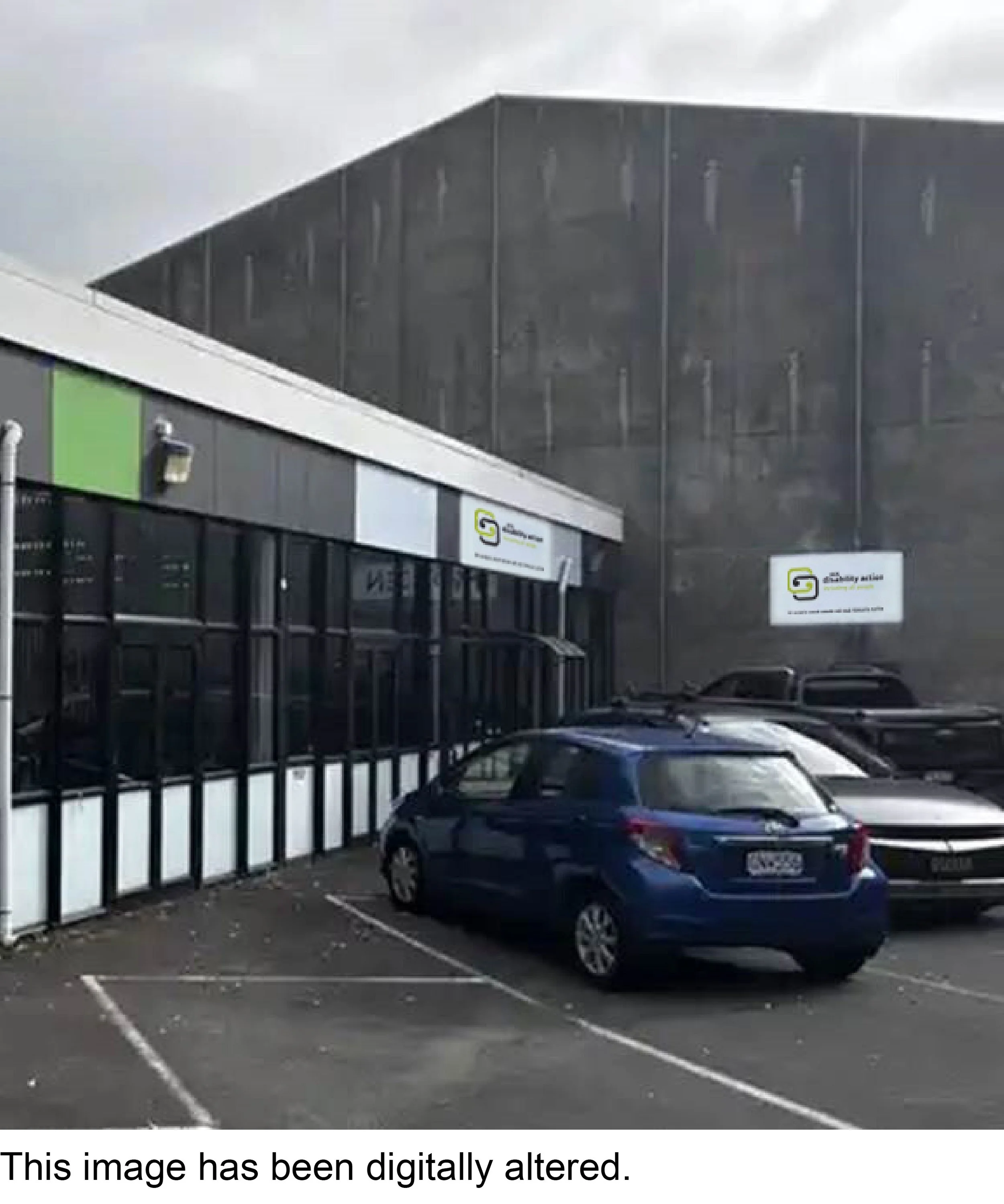 The new building with CCSDA signage and parking lot with one car parked.
