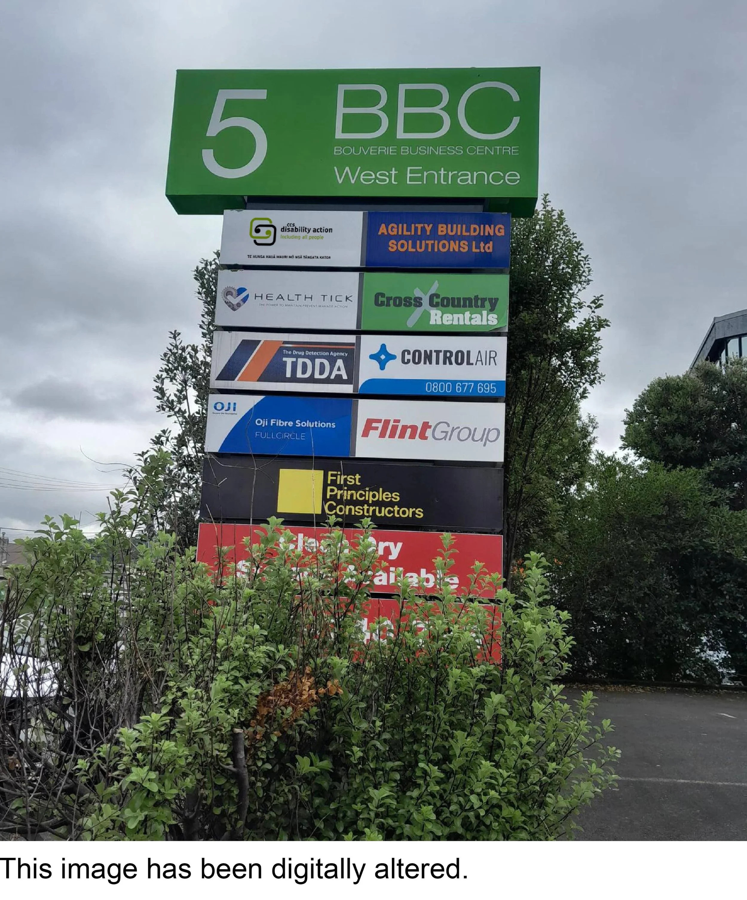 Signpost with business logos including CCS Disability Action.