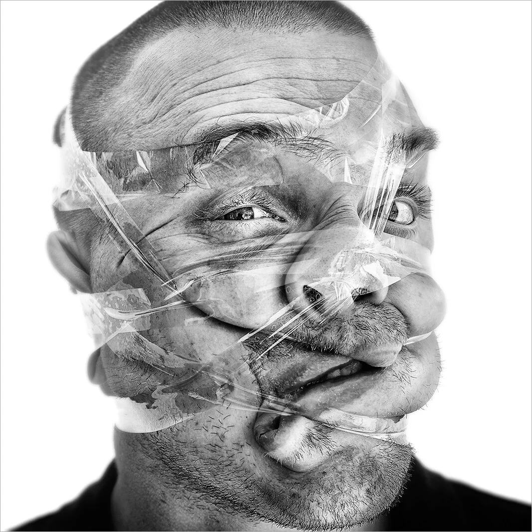 Portrait serré où le ruban adhésif écrase le nez et la lèvre supérieure, provoquant une moue comique. Photographie noir et blanc dense mettant en valeur les textures de la peau.