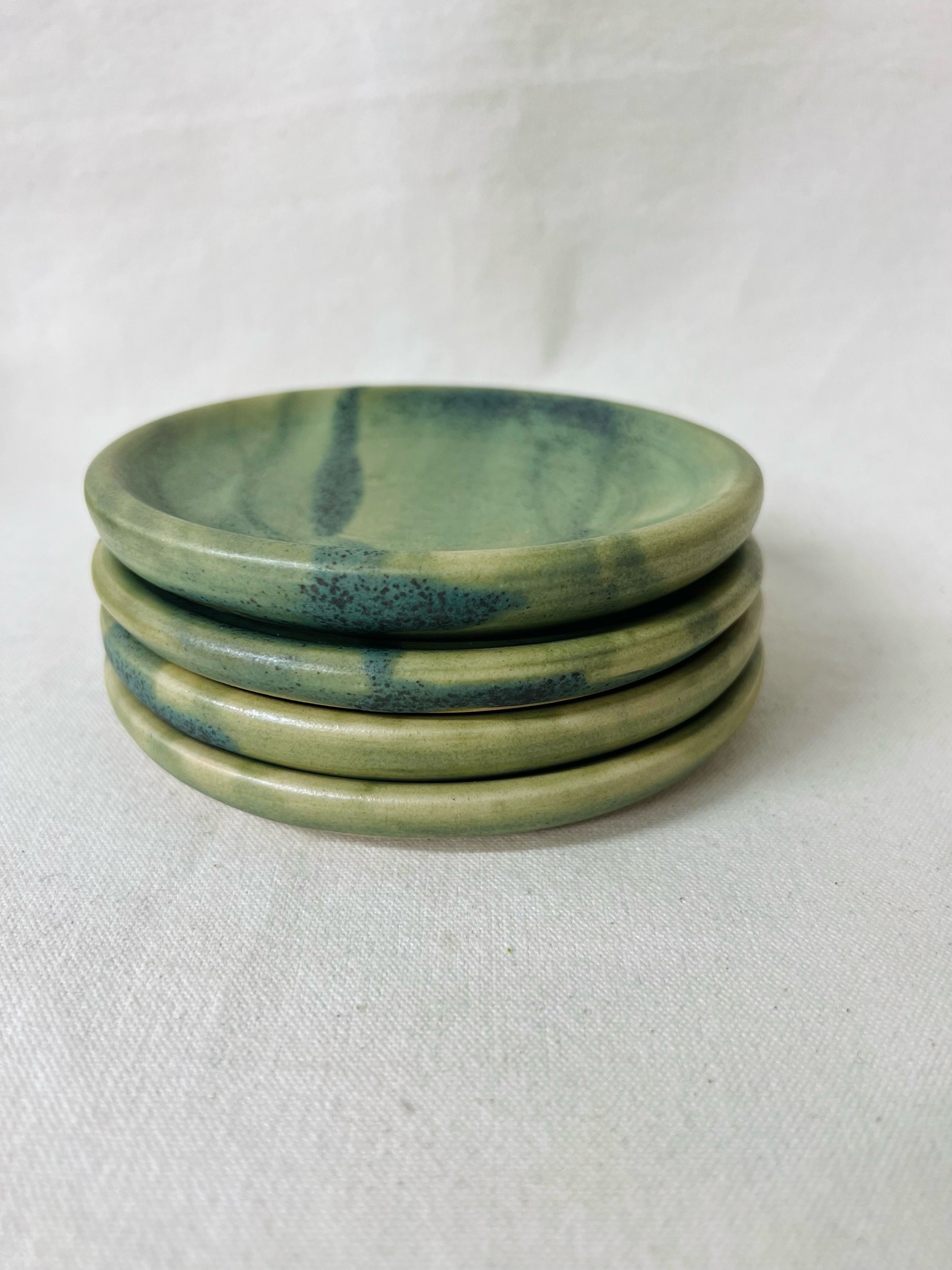 Green ceramic handmade spoon rest, made in Glasgow, Scotland. Modern rustic pottery. Contemporary handmade ceramics. Pottery inspired by nature.