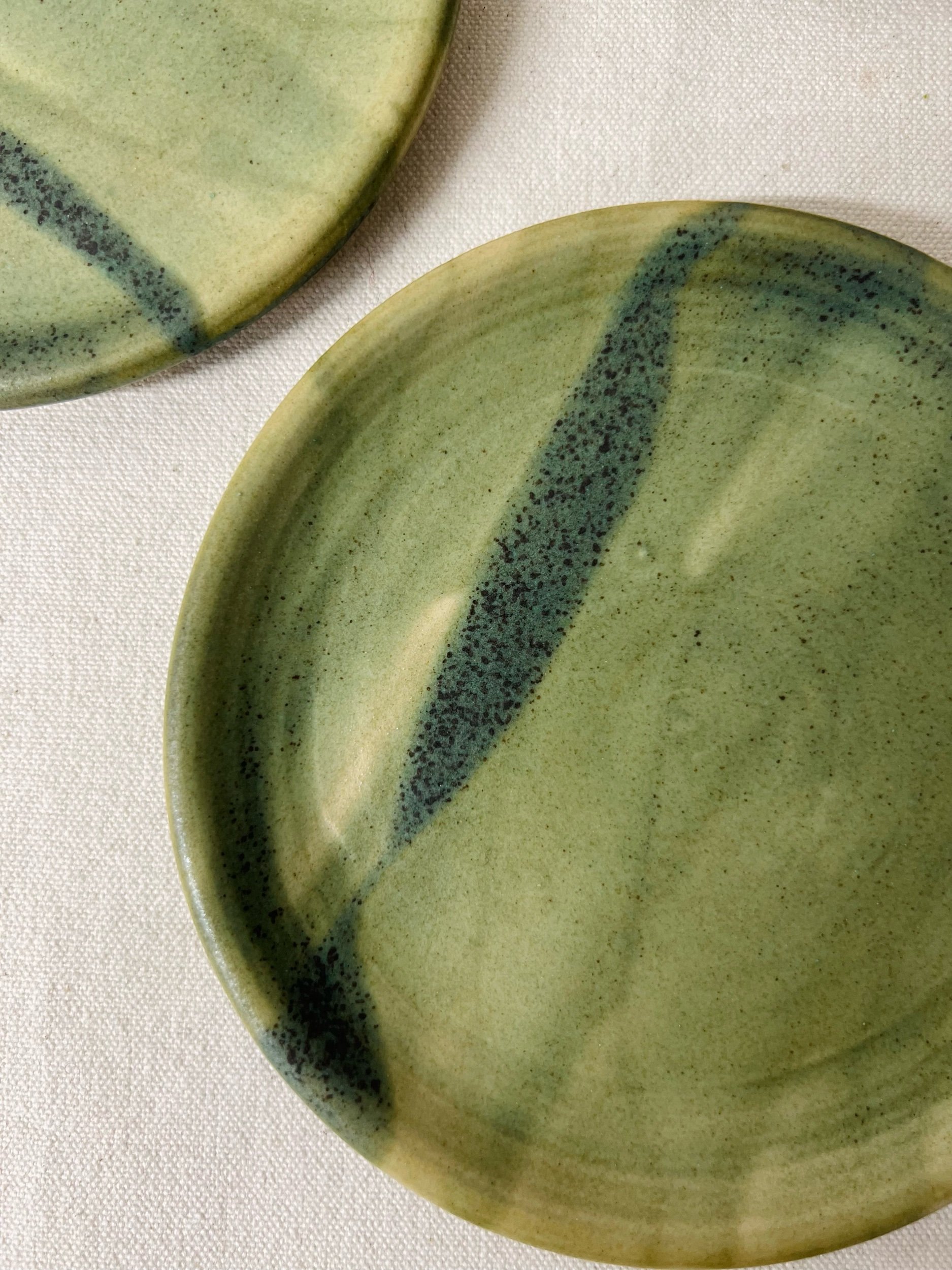 Green ceramic handmade spoon rest, made in Glasgow, Scotland. Modern rustic pottery. Contemporary handmade ceramics. Pottery inspired by nature.