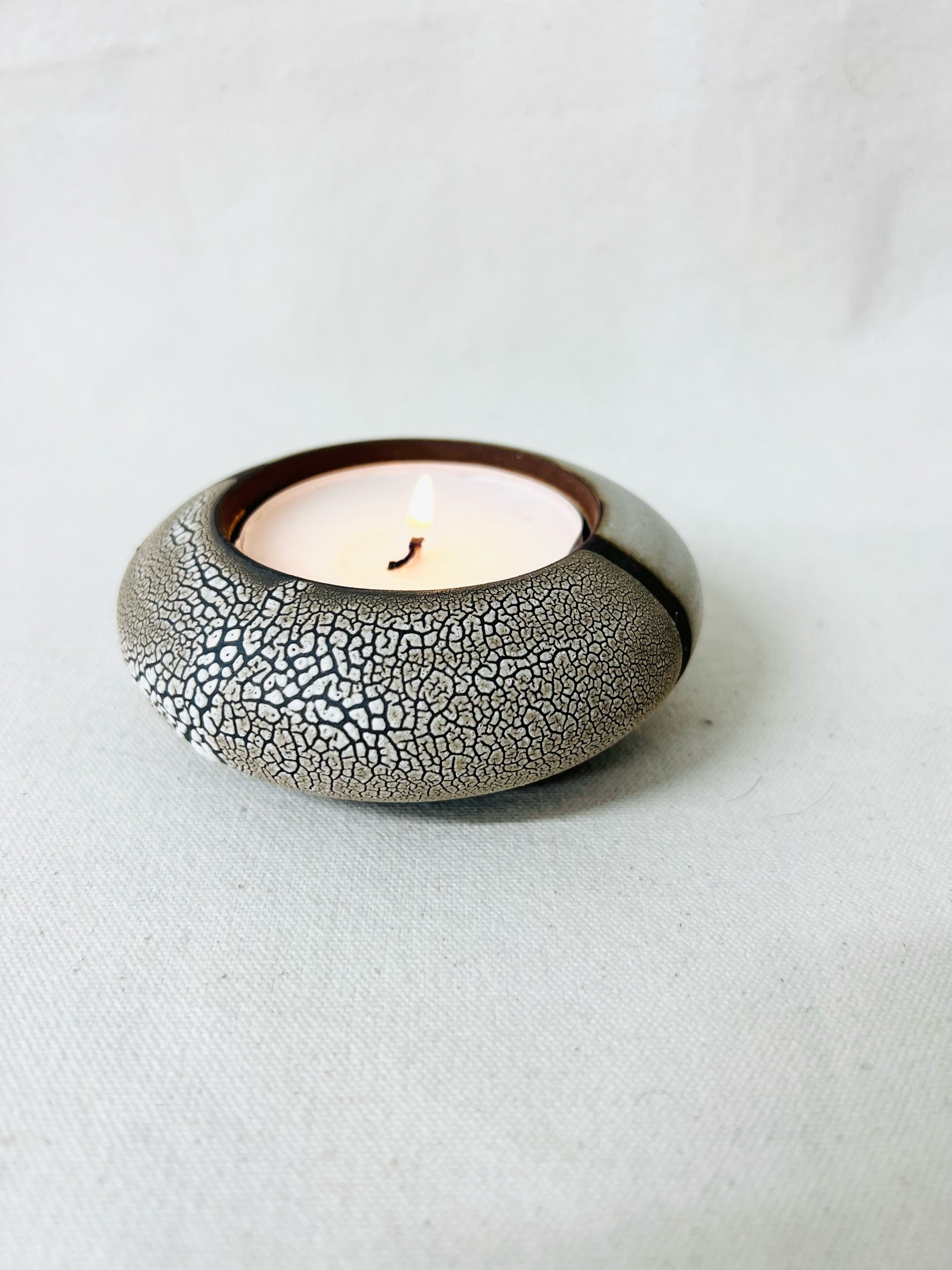 Handmade tea light candle holder. Design inspired by nature. Abstract landscape design. Artisan ceramics. Handmade pottery made in Glasgow, Scotland.