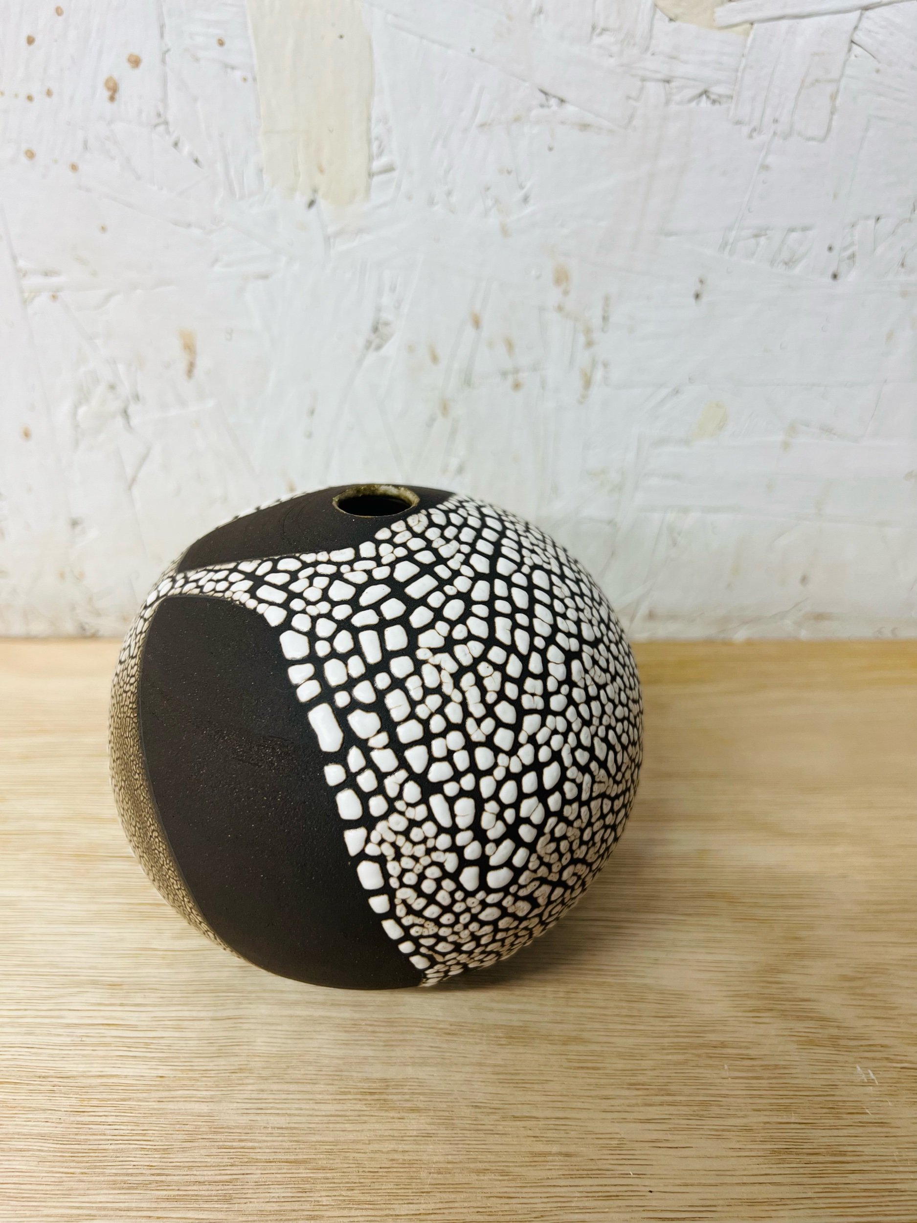 Small, handmade ceramic bud vase made with black stoneware. Made in Scotland. Handmade rustic stoneware vase made in Glasgow. Home decor inspired by nature. unique handmade vases. Handmade gifts.