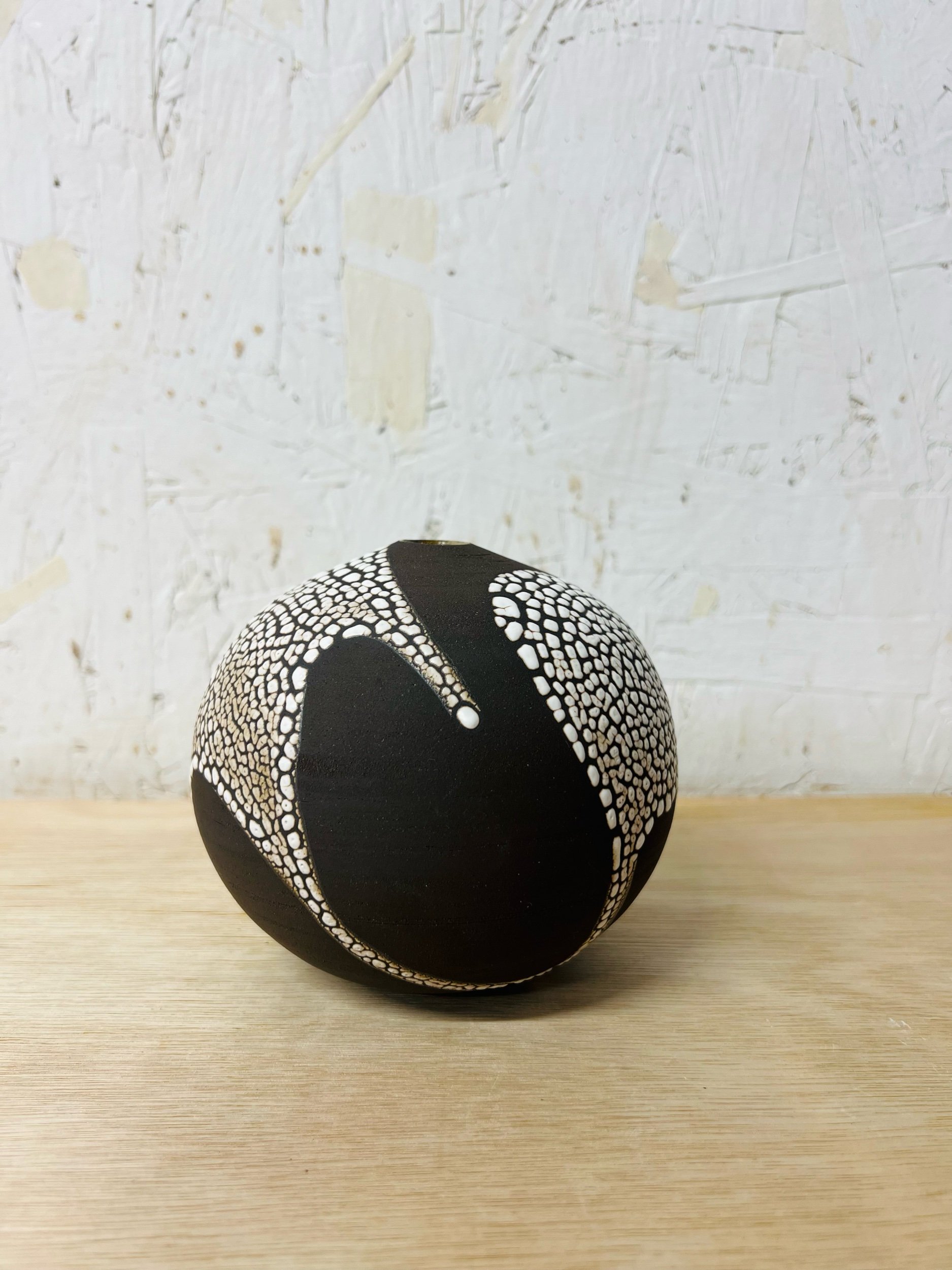 Small, handmade ceramic bud vase made with black stoneware. Made in Scotland. Handmade rustic stoneware vase made in Glasgow. Home decor inspired by nature. unique handmade vases. Handmade gifts.
