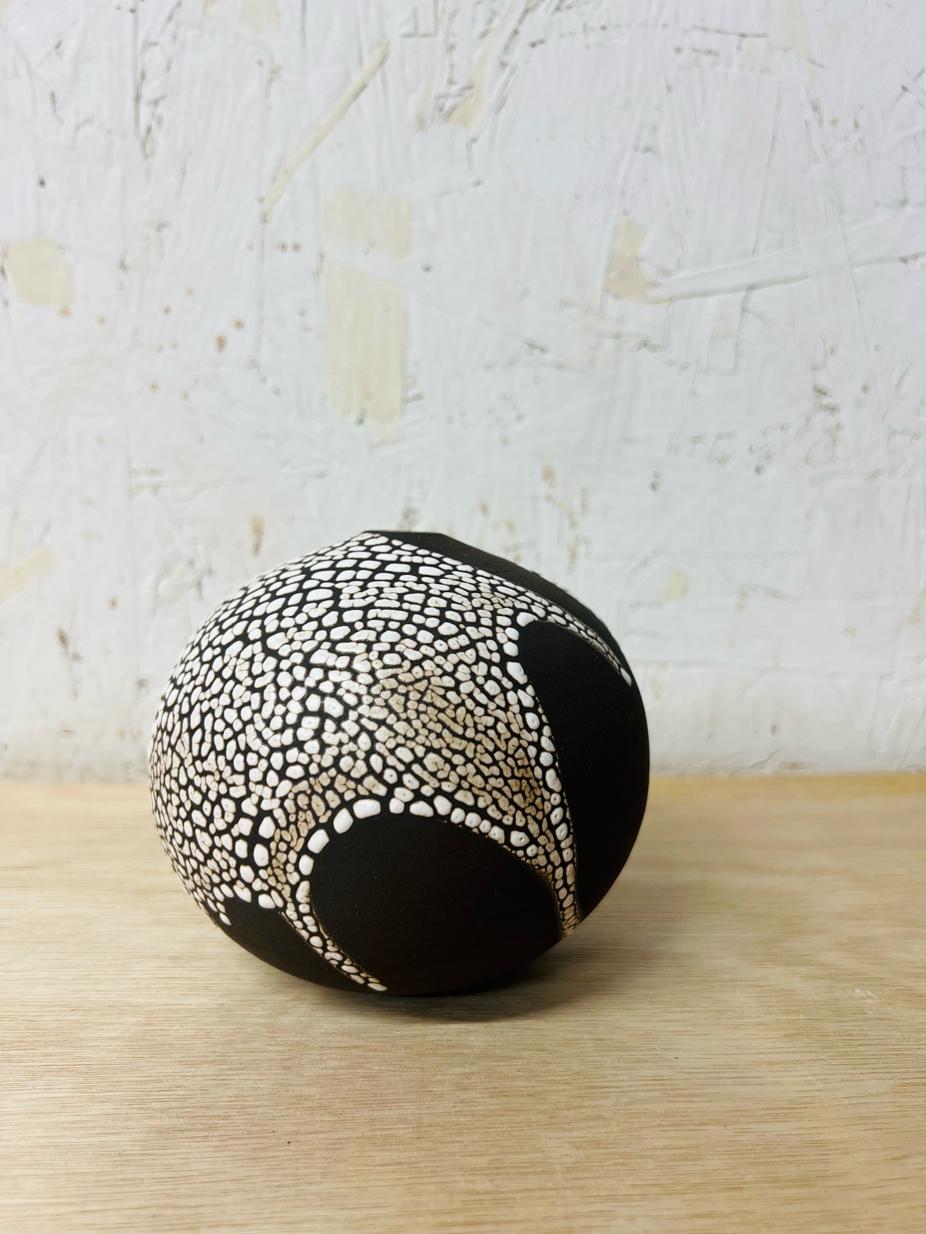 Small, handmade ceramic bud vase made with black stoneware. Made in Scotland. Handmade rustic stoneware vase made in Glasgow. Home decor inspired by nature. unique handmade vases. Handmade gifts.