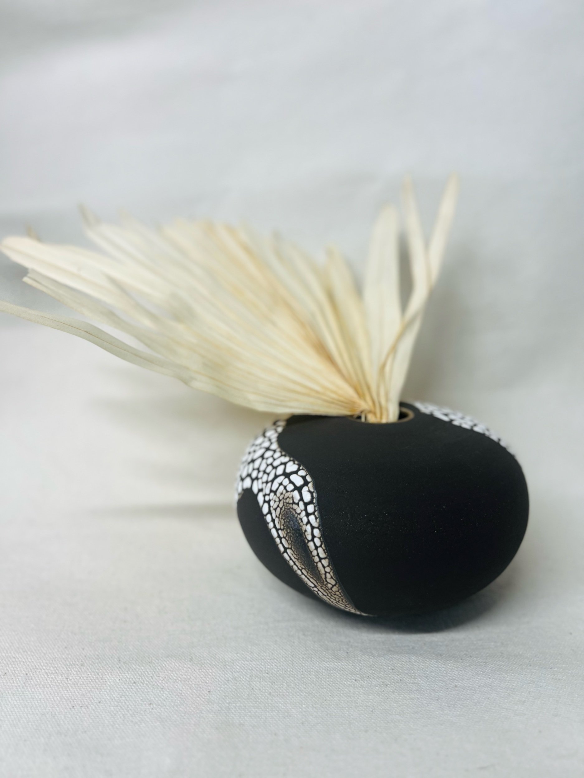 Small, handmade ceramic bud vase made with black stoneware. Made in Scotland. Handmade rustic stoneware vase made in Glasgow. Home decor inspired by nature. unique handmade vases. Handmade gifts.