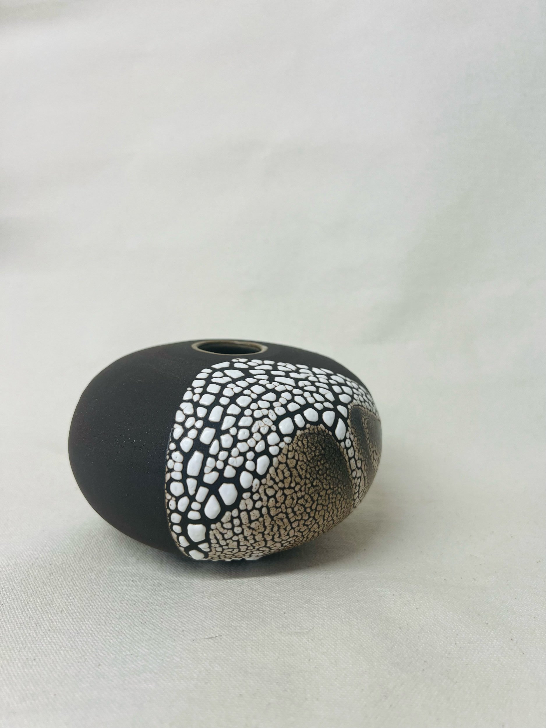 Small, handmade ceramic bud vase made with black stoneware. Made in Scotland. Handmade rustic stoneware vase made in Glasgow. Home decor inspired by nature. unique handmade vases. Handmade gifts.