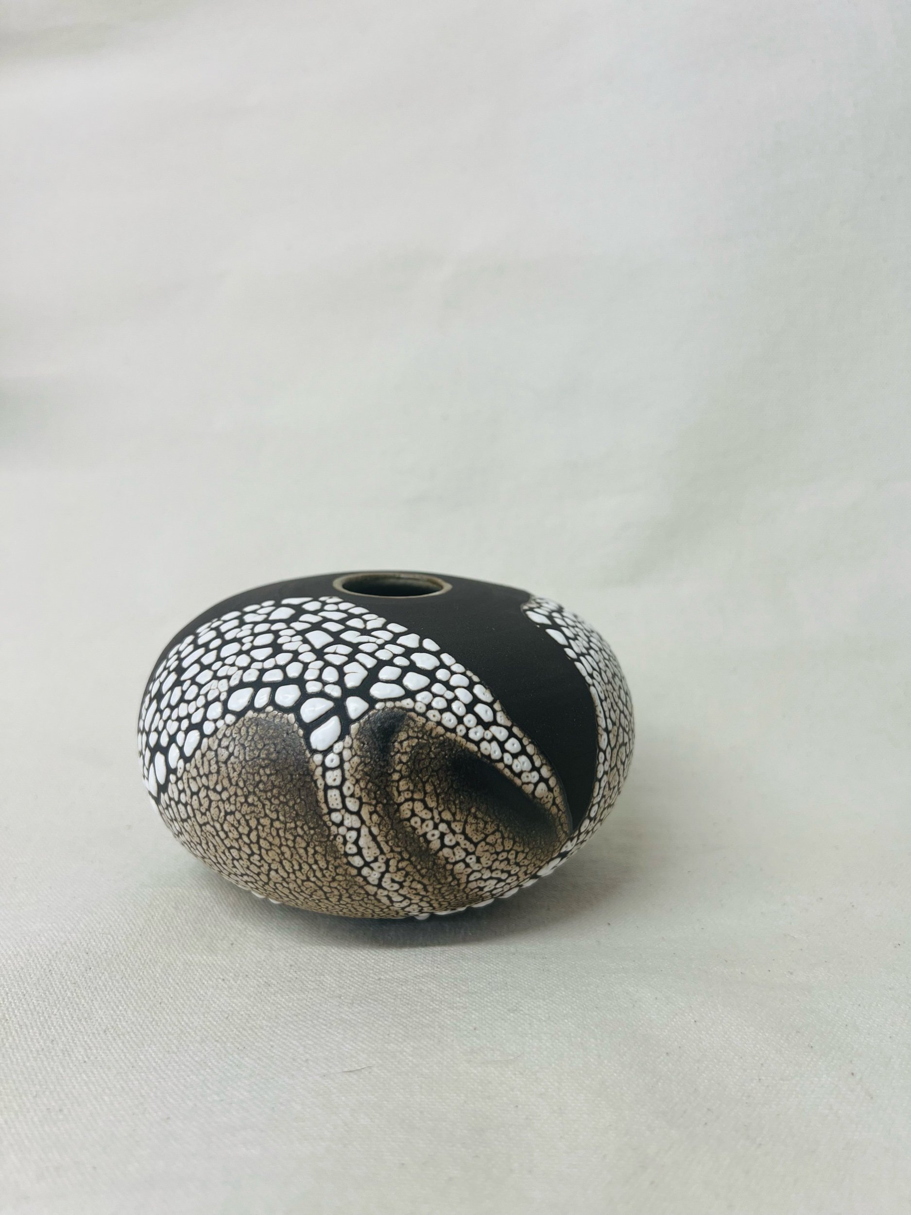 Small, handmade ceramic bud vase made with black stoneware. Made in Scotland. Handmade rustic stoneware vase made in Glasgow. Home decor inspired by nature. unique handmade vases. Handmade gifts.