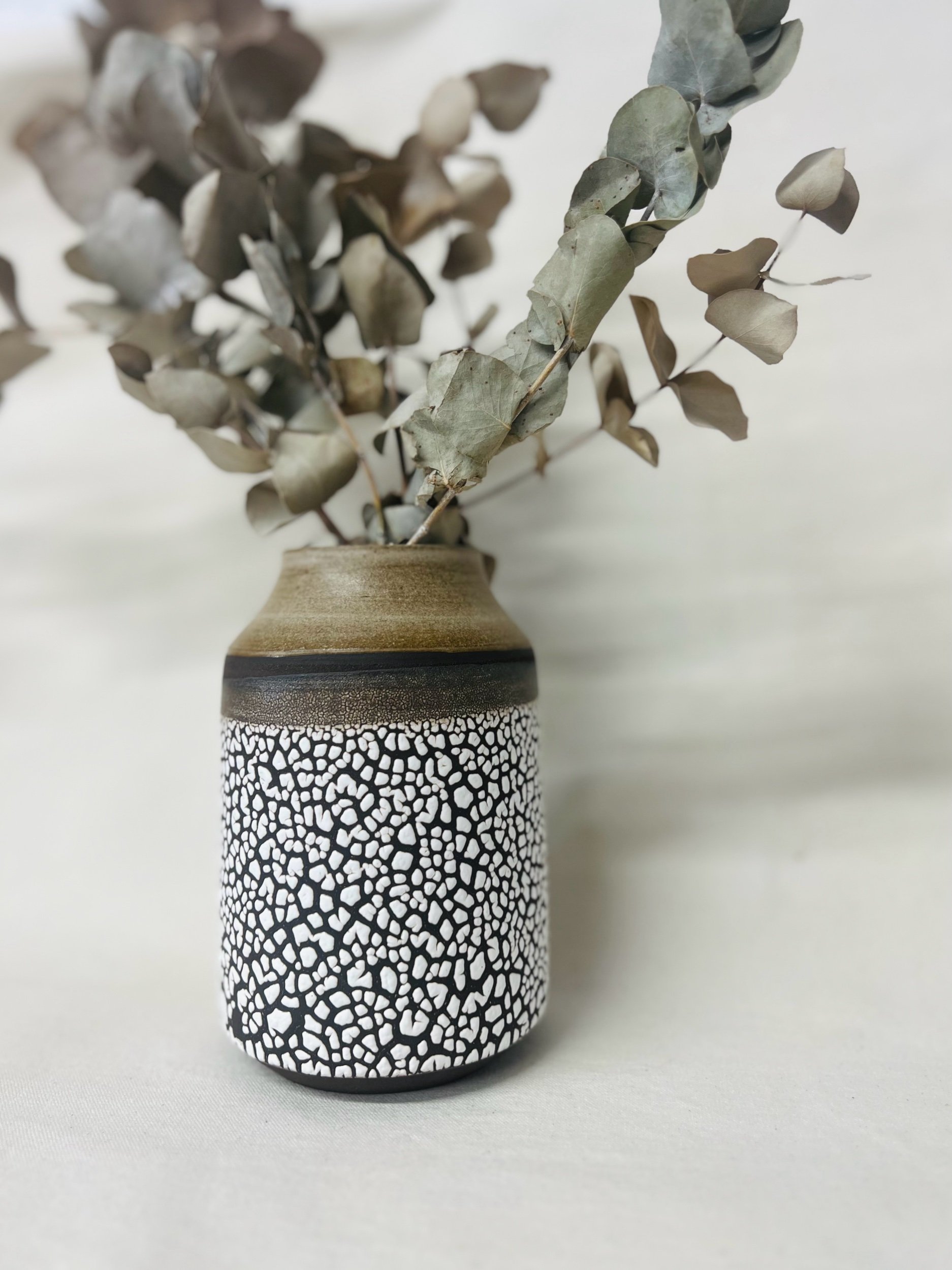 handmade ceramic vase made with black stoneware. Made in Scotland. Handmade rustic stoneware vase made in Glasgow. Home decor inspired by nature. unique handmade vases. Handmade gifts.