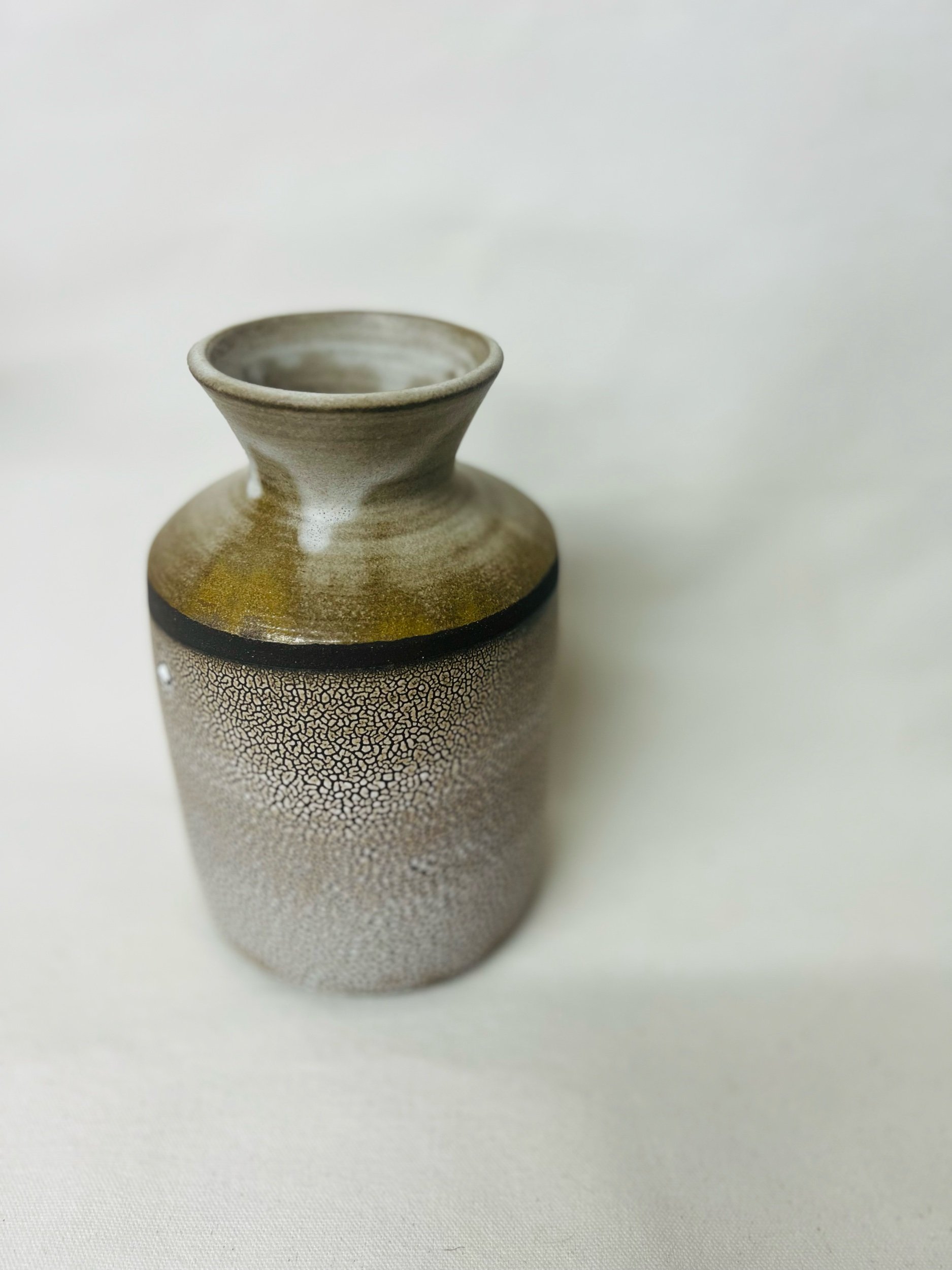 Modern rustic vase made in Scotland. Pottery handmade in Glasgow. Unique gift ideas inspired by nature. Handmade home decor.