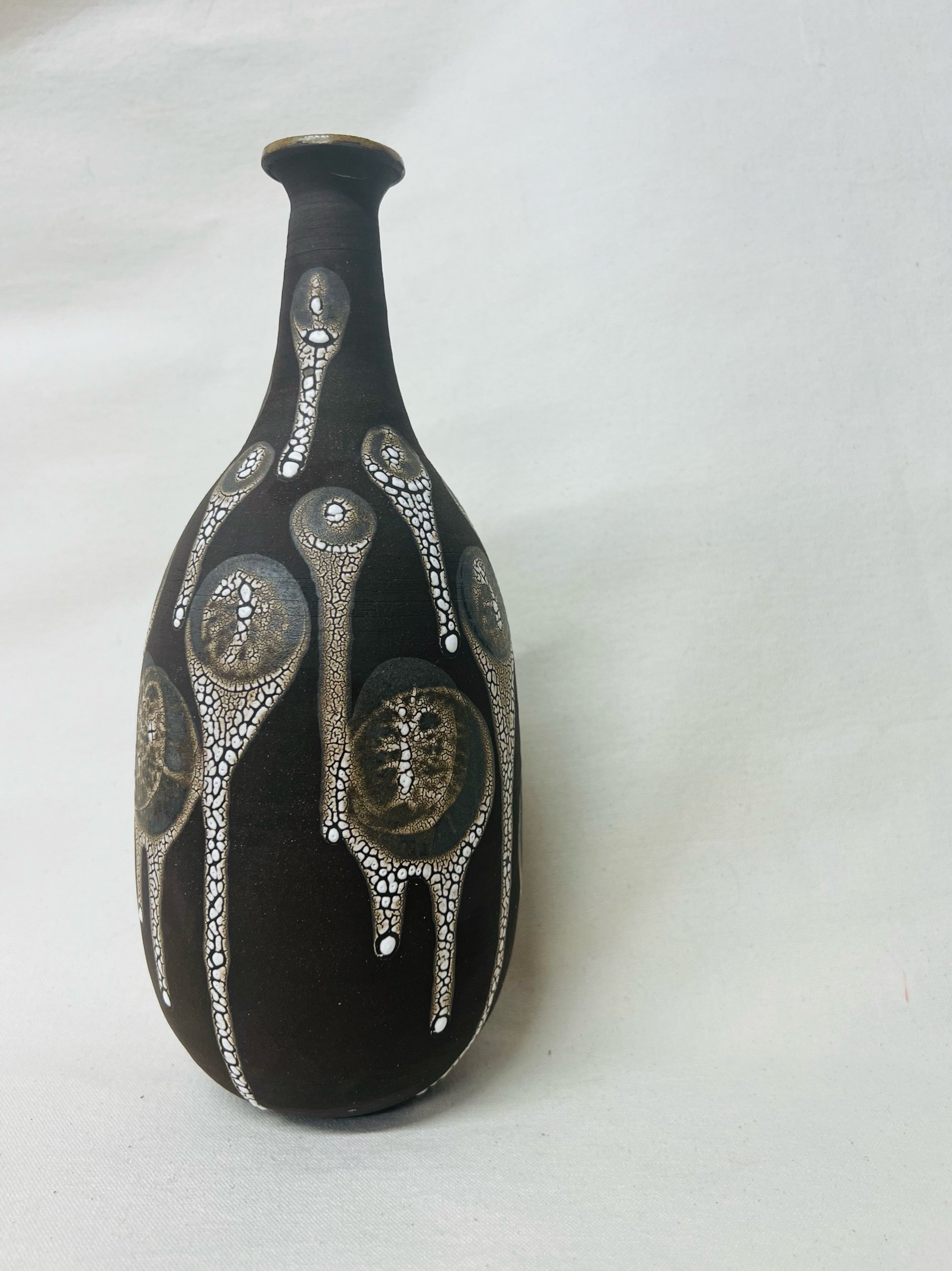 Black, handmade ceramic vase made in Glasgow, Scotland. Unique Scottish gift ideas. Modern rustic pottery inspired by nature.
