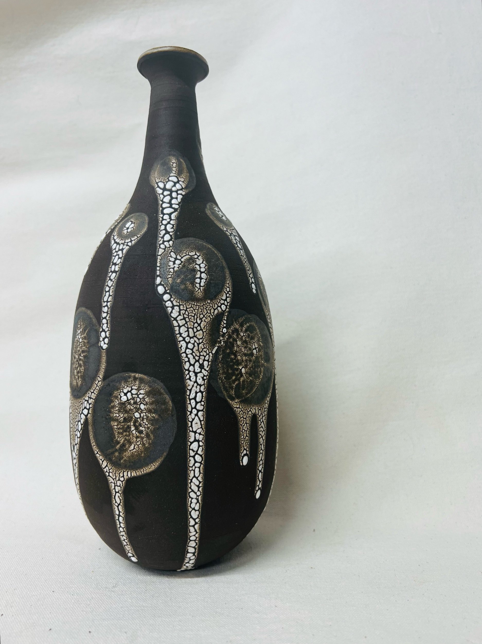 Black, handmade ceramic vase made in Glasgow, Scotland. Unique Scottish gift ideas. Modern rustic pottery inspired by nature.