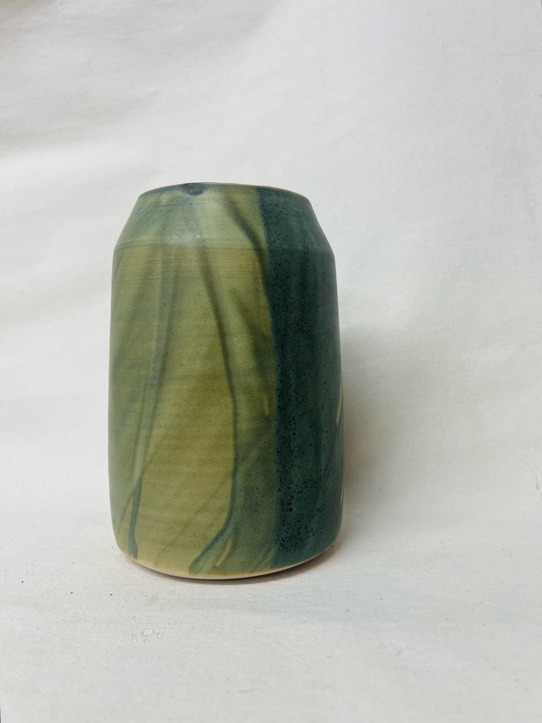Large, handmade ceramic vase with a green glaze made in Scotland. Crafted with white stoneware clay. Scottish home decor inspired by nature. unique handmade vases. Scottish handmade gifts.