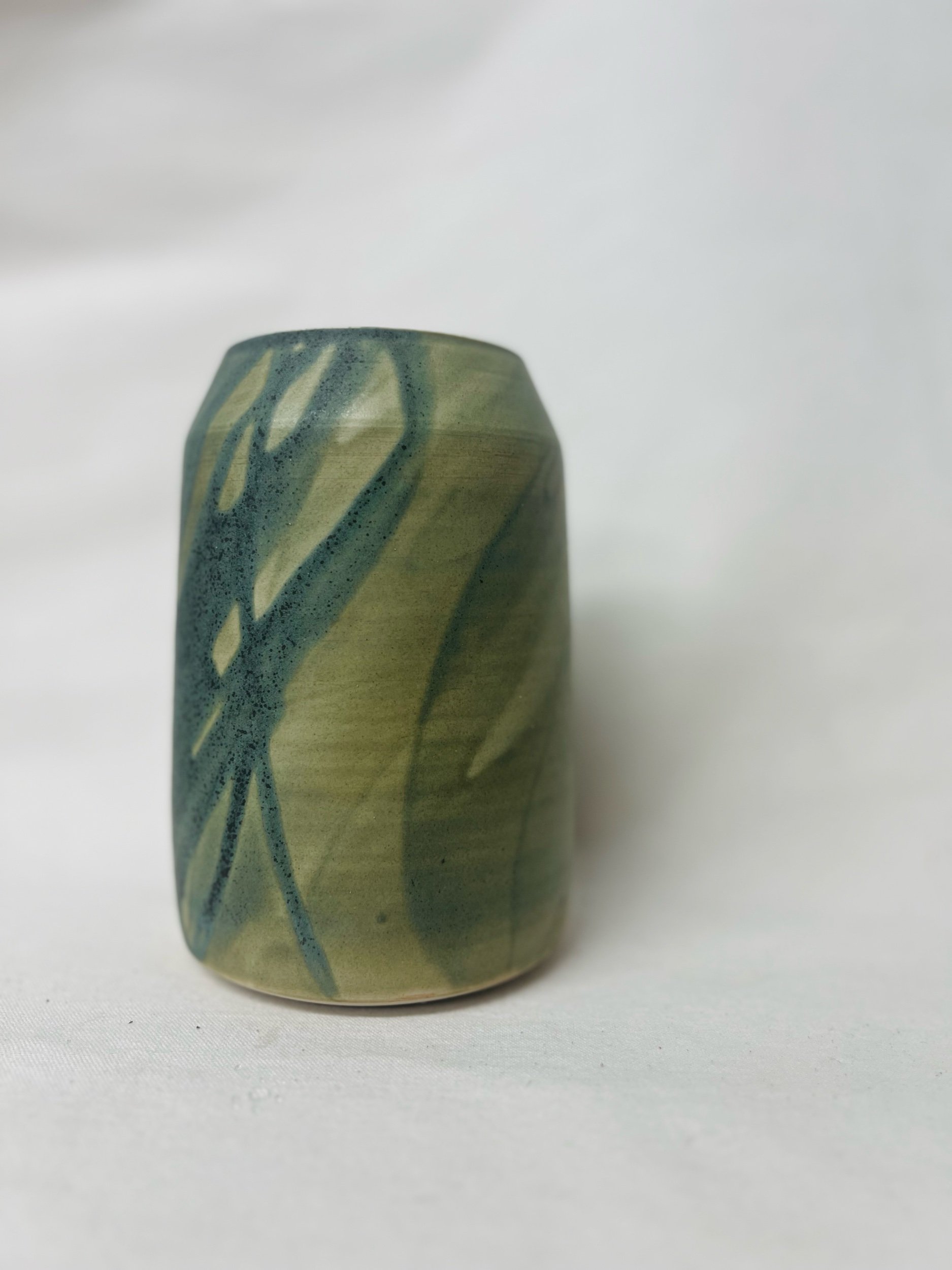 Large, handmade ceramic vase with a green glaze made in Scotland. Crafted with white stoneware clay. Scottish home decor inspired by nature. unique handmade vases. Scottish handmade gifts.