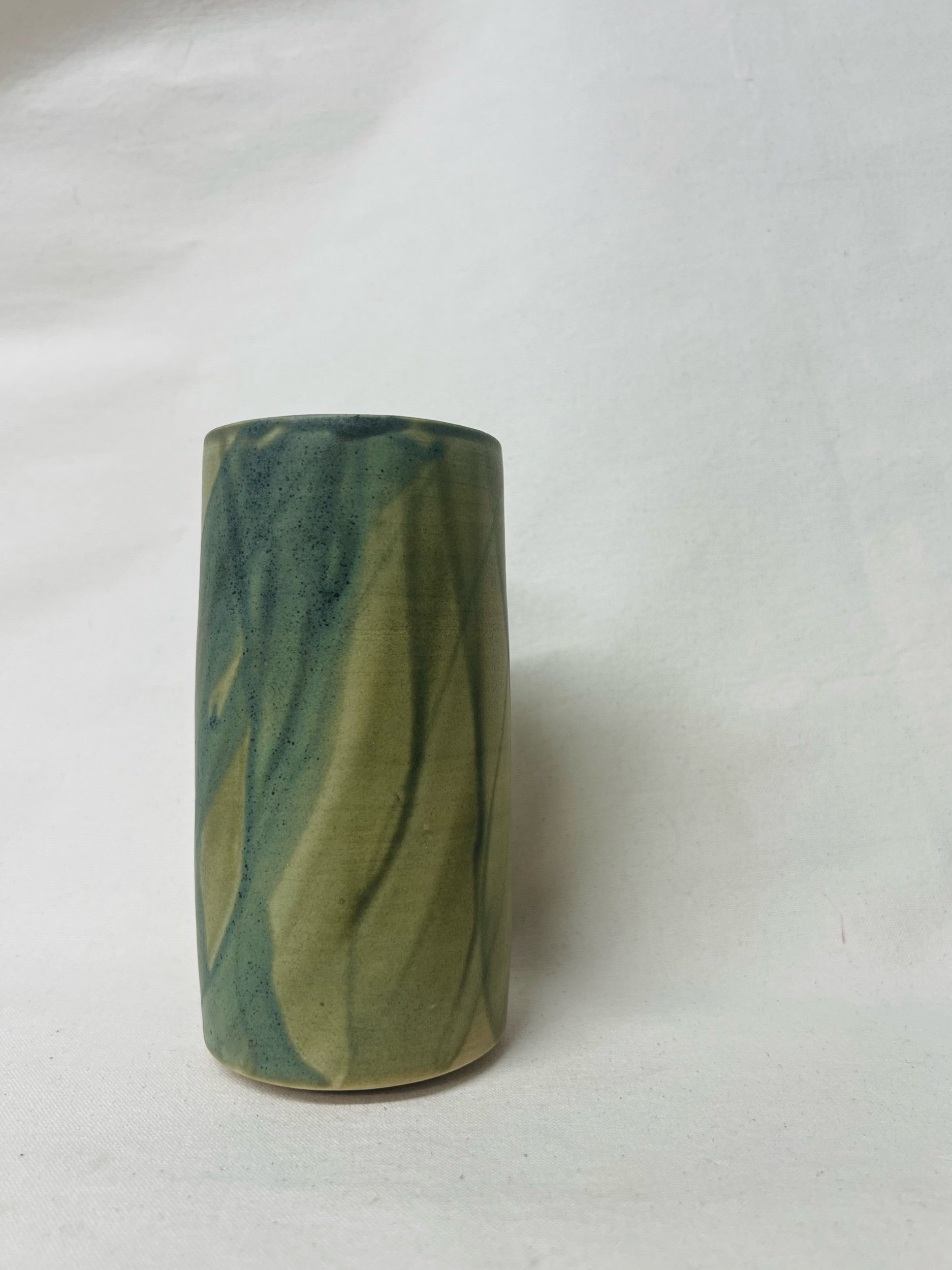 Large, handmade ceramic vase with a green glaze made in Scotland. Crafted with white stoneware clay. Scottish home decor inspired by nature. unique handmade vases. Scottish handmade gifts.