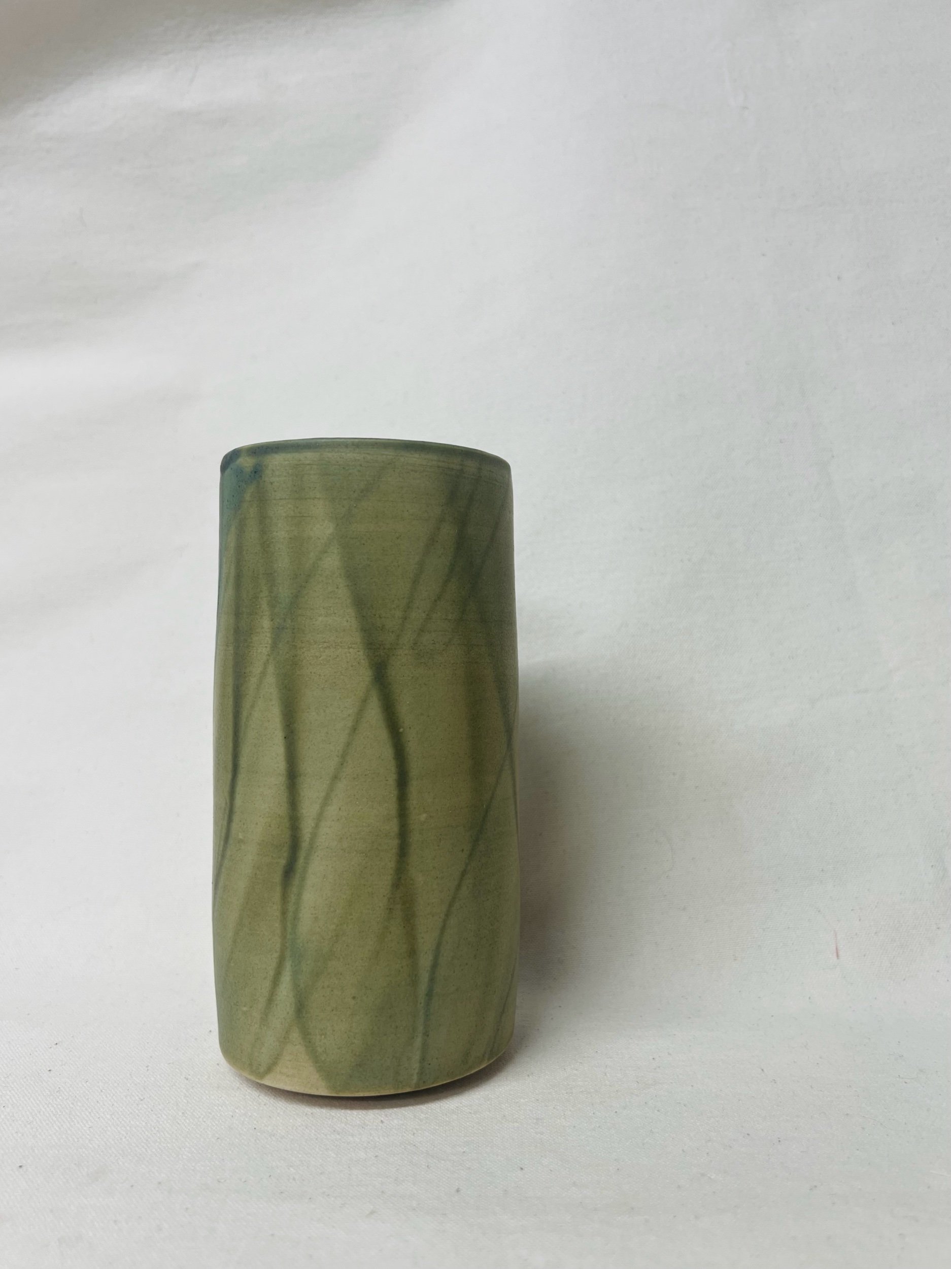 Large, handmade ceramic vase with a green glaze made in Scotland. Crafted with white stoneware clay. Scottish home decor inspired by nature. unique handmade vases. Scottish handmade gifts.
