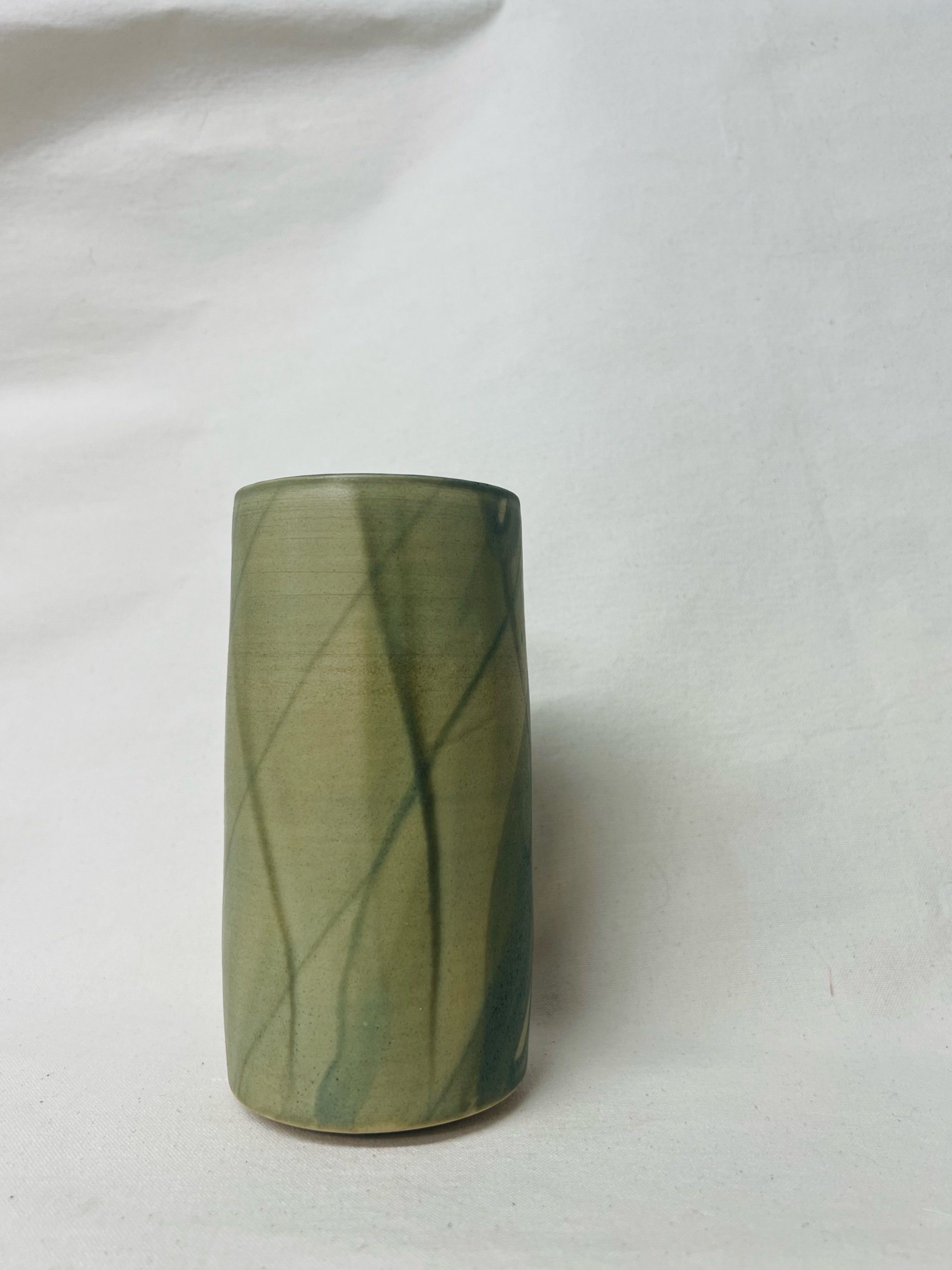Large, handmade ceramic vase with a green glaze made in Scotland. Crafted with white stoneware clay. Scottish home decor inspired by nature. unique handmade vases. Scottish handmade gifts.