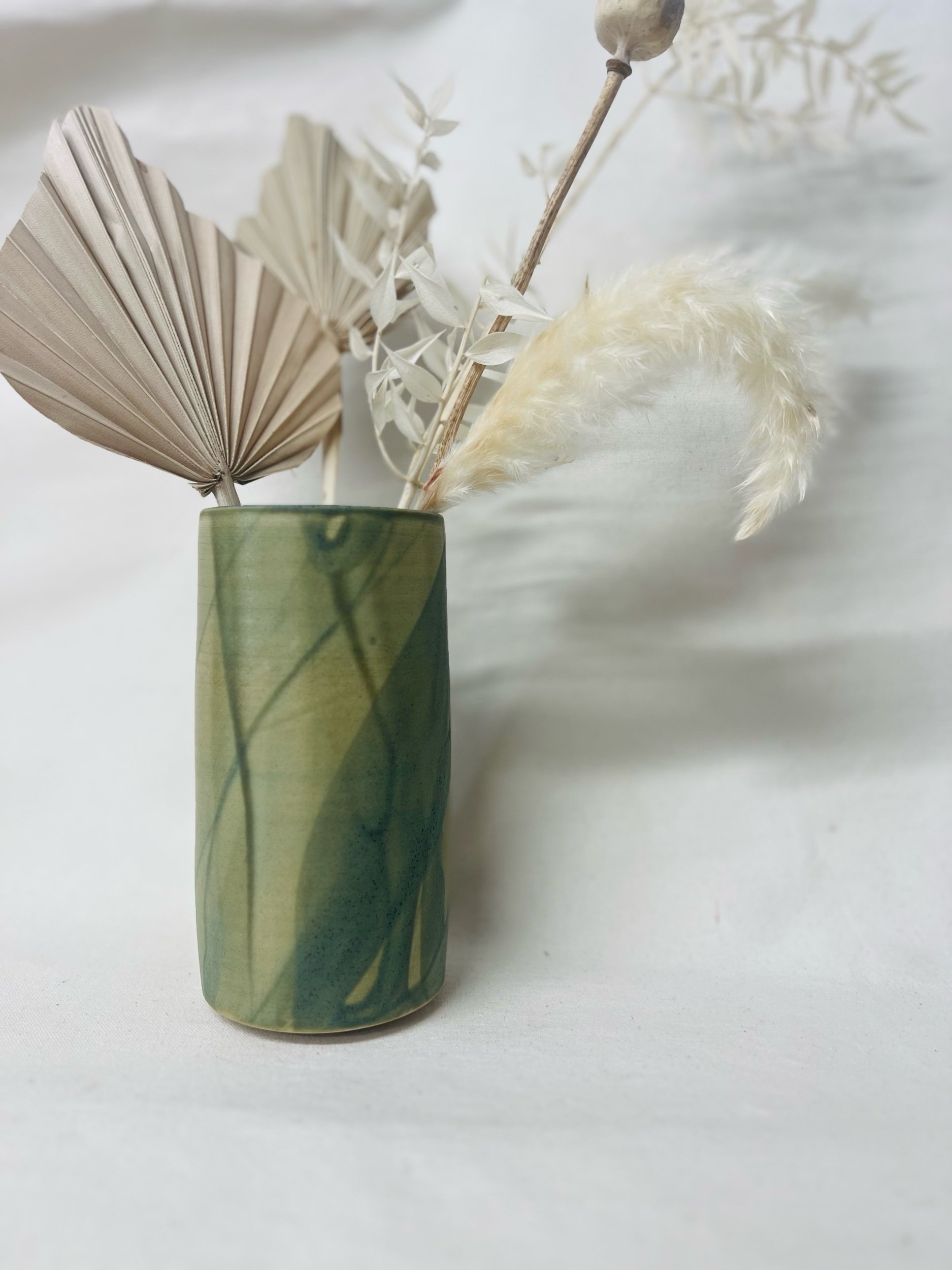 Large, handmade ceramic vase with a green glaze made in Scotland. Crafted with white stoneware clay. Scottish home decor inspired by nature. unique handmade vases. Scottish handmade gifts.