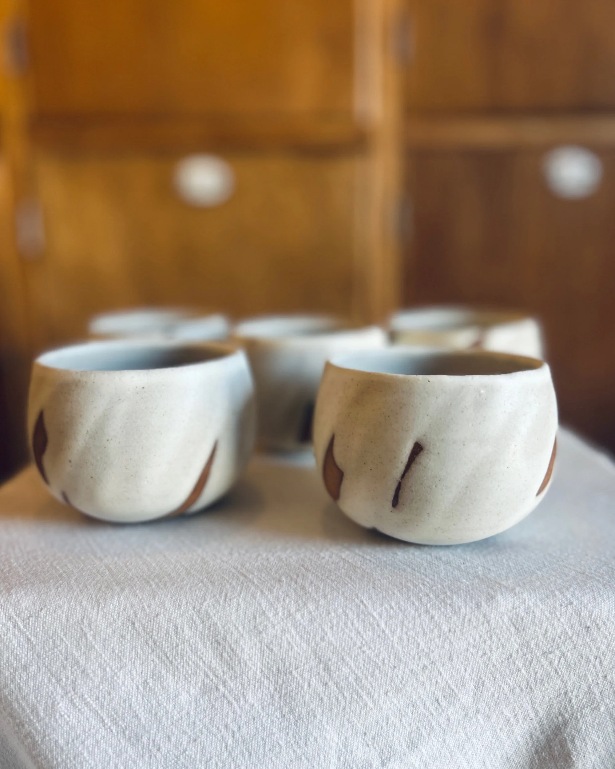 Handmade stoneware tumbler made with buff clay and glazed with a matte white glaze. Pottery made in Scotland, inspired by nature.