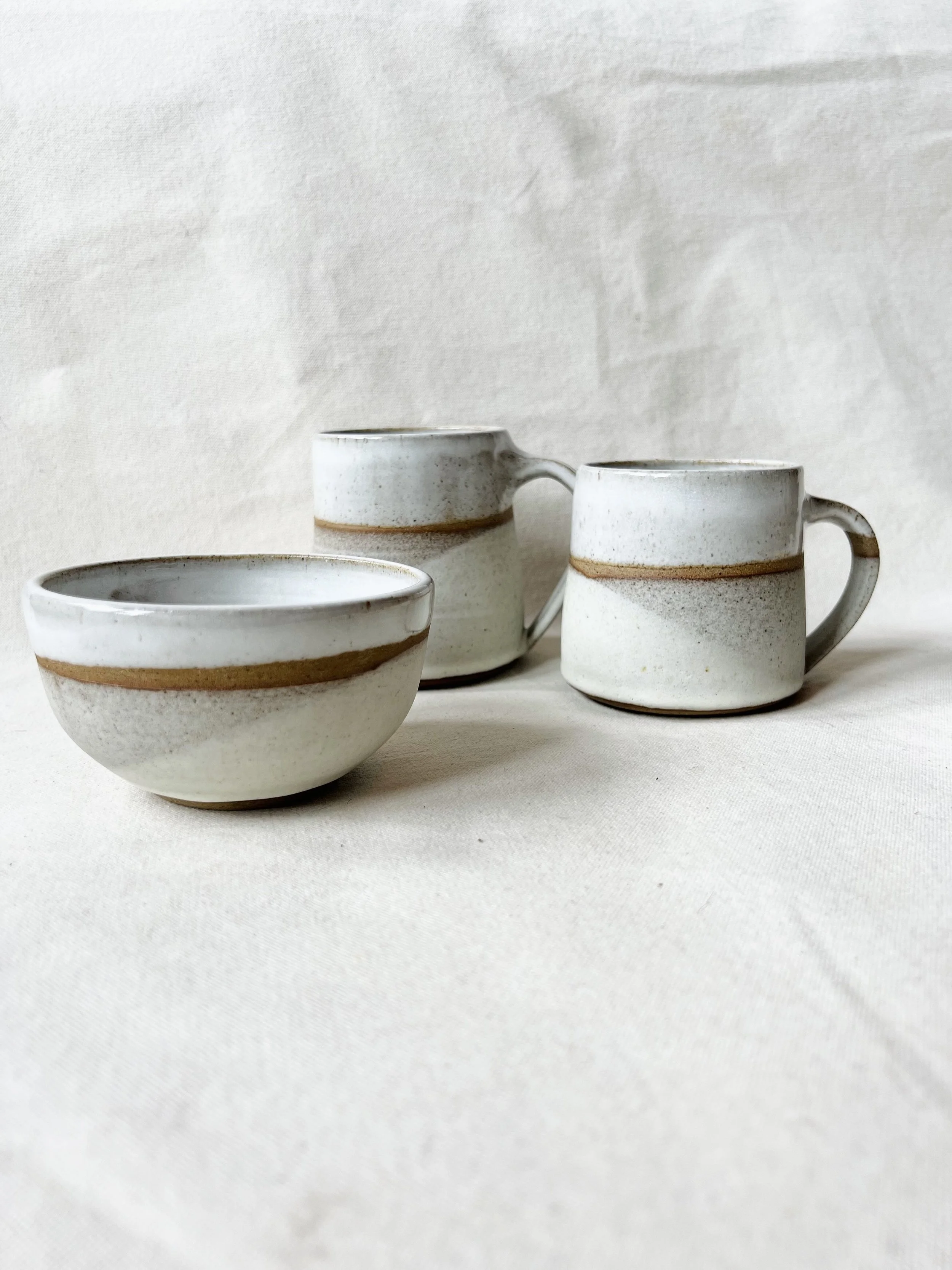 Suilven Collection - toasted stoneware clay, wheel-thrown and glazed with a combination of matte and gloss glazes. Abstract mountain design. Handmade pottery inspired by nature, made in Glasgow, Scotland.