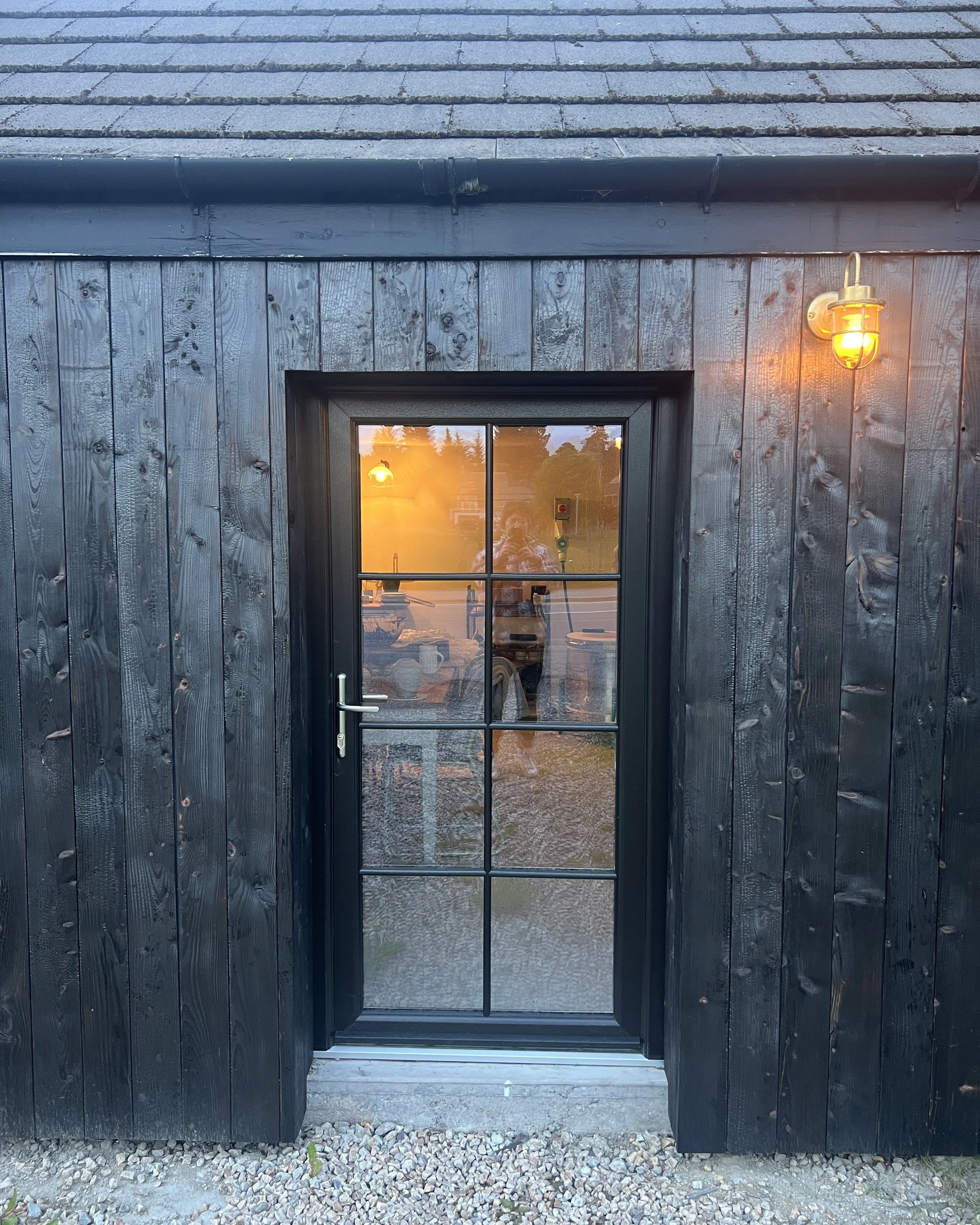 The entrance to Kim Plimley's ceramics studio in Carrbridge, Cairngorms, at dusk