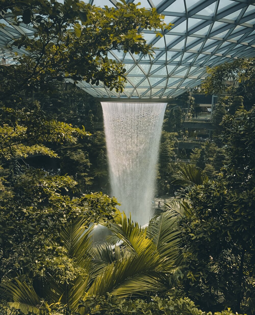 The Jewel - a giant mall and waterfall at Singapore's Changi Airport. Not without reason, Singapore's Changi Airport is one of the world's most popular and well-known airports. In addition to the famous waterfall in The Jewel, you can kill time durin