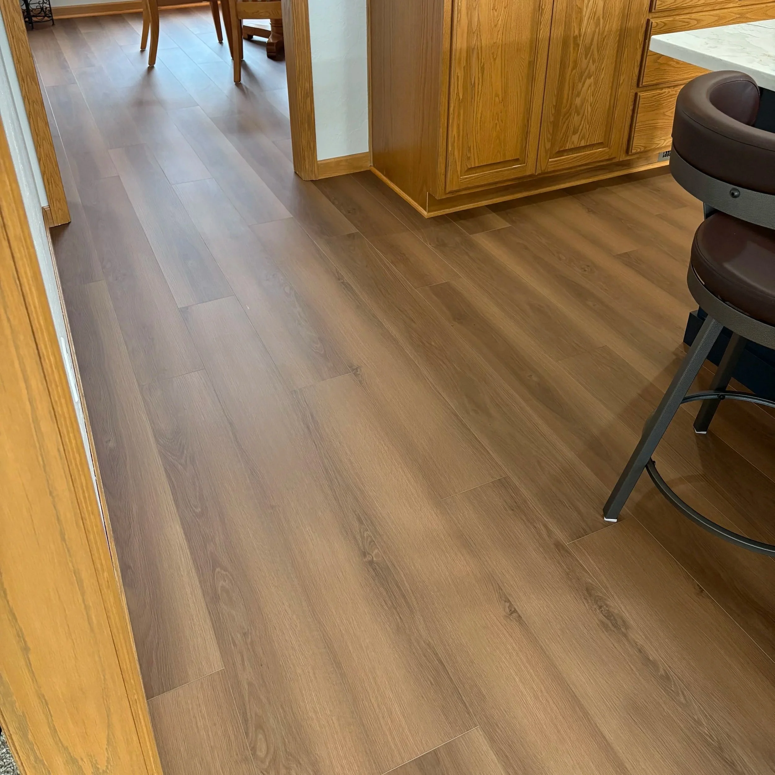 Empty room with beige walls, gray carpet, a ceiling fan with lights, and a window on the right side