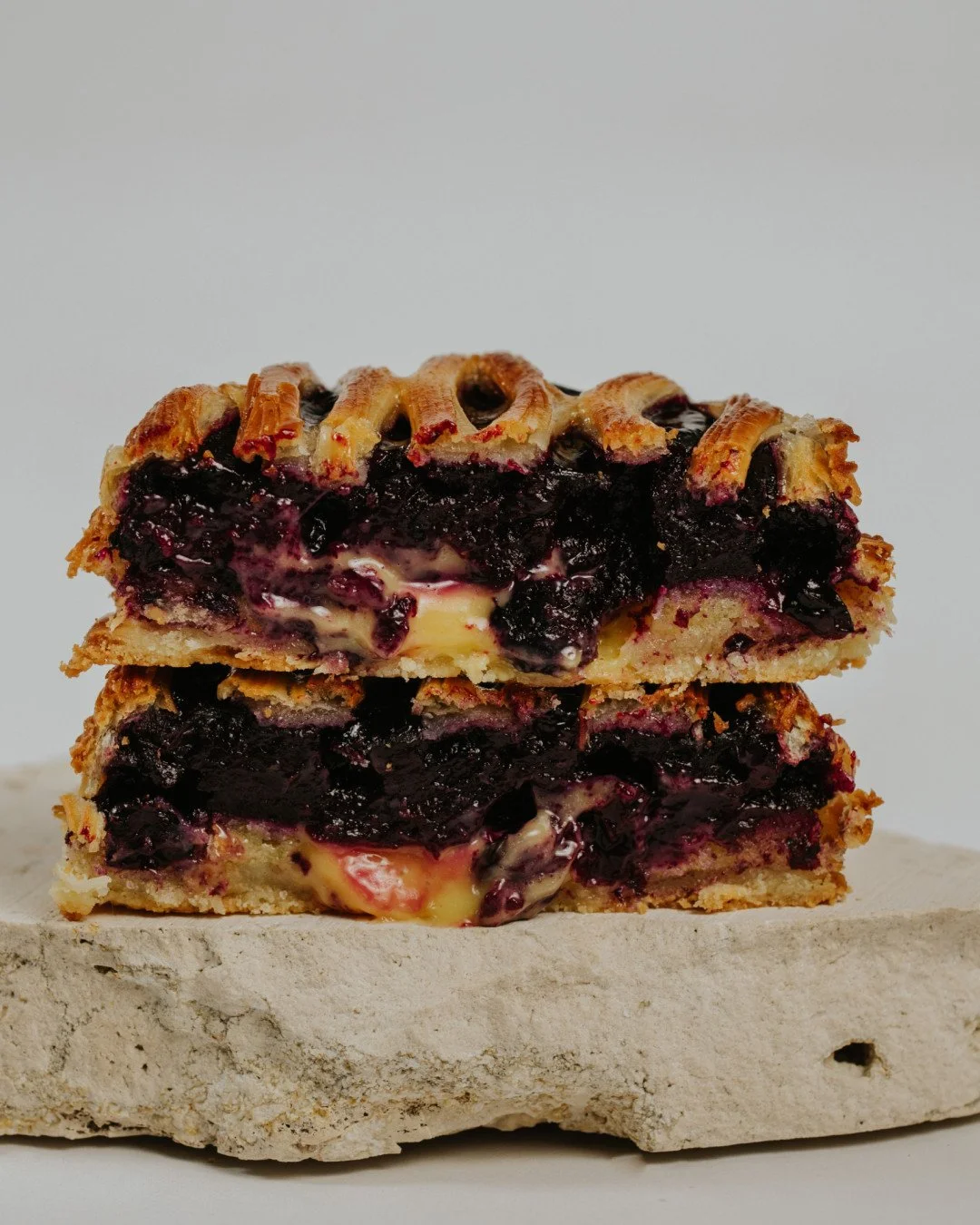 Autumn flavours 🫐⁠
⁠
Our Blueberry &amp; Lemon Lattice layers delicate croissant pastry over lemon sponge and juicy blueberries, all resting on a buttery citrus shortcrust and finished with a glossy glaze. ⁠
⁠
Duck in and meet your new seasonal favo