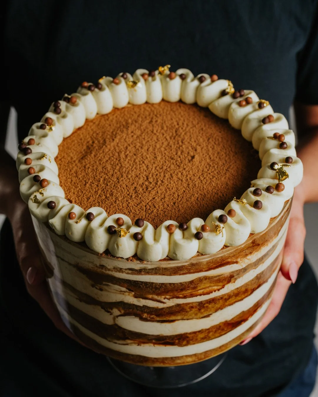 Our Tiramisu Trifle is layered with coffee-soaked vanilla sponge, orange-spiced vanilla cream and finished with cocoa, chocolate crisp pearls and touches of gold. Rich and generous, perfect for sharing around the table.⁠
⁠
Pre-orders are open online.