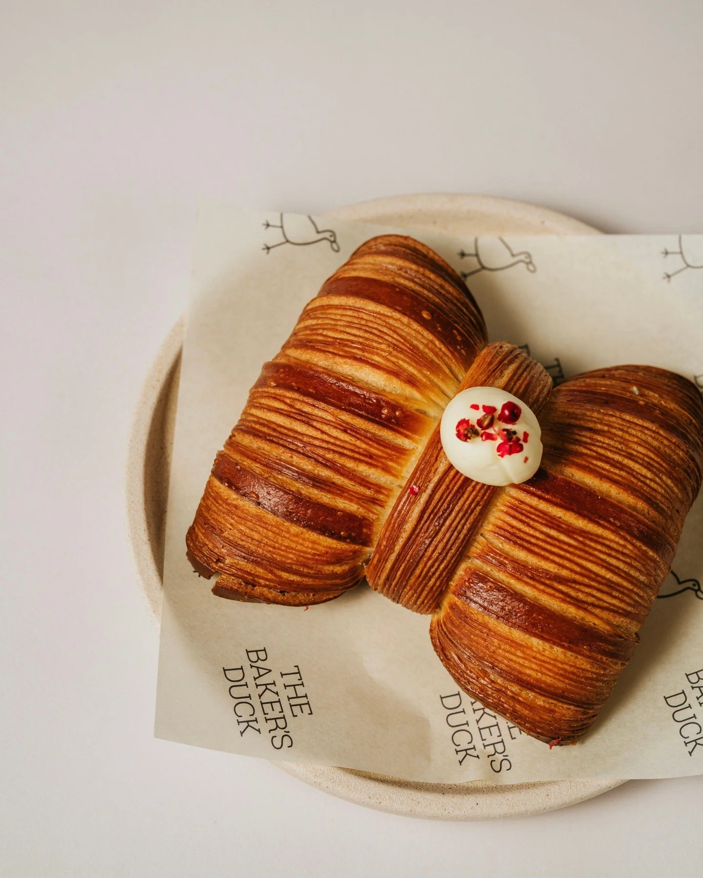 Tying up the season in a bow 🎀 Our Rhubarb &amp; Pink Peppercorn Croissant Bow is only here for a little longer 🥹 Cross-laminated croissant dough filled with pink peppercorn cream and rhubarb jam. ⁠
⁠
Duck in for one more before it's gone. ⁠
⁠
#the