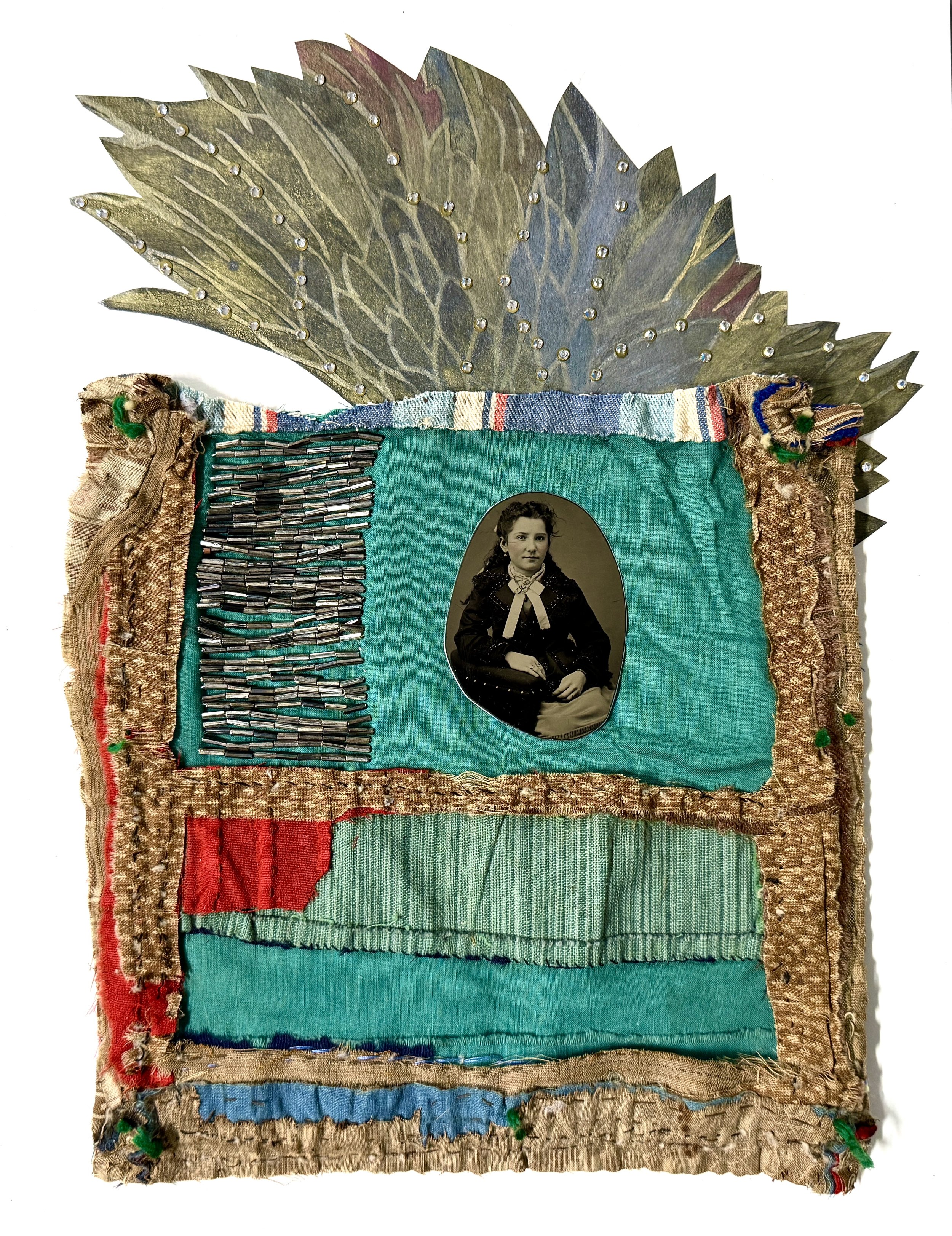 Feathered, 2025, ink, pencil, repurposed quilt, beads, crystals, paper on 4ply mat board, 14 x 11 in