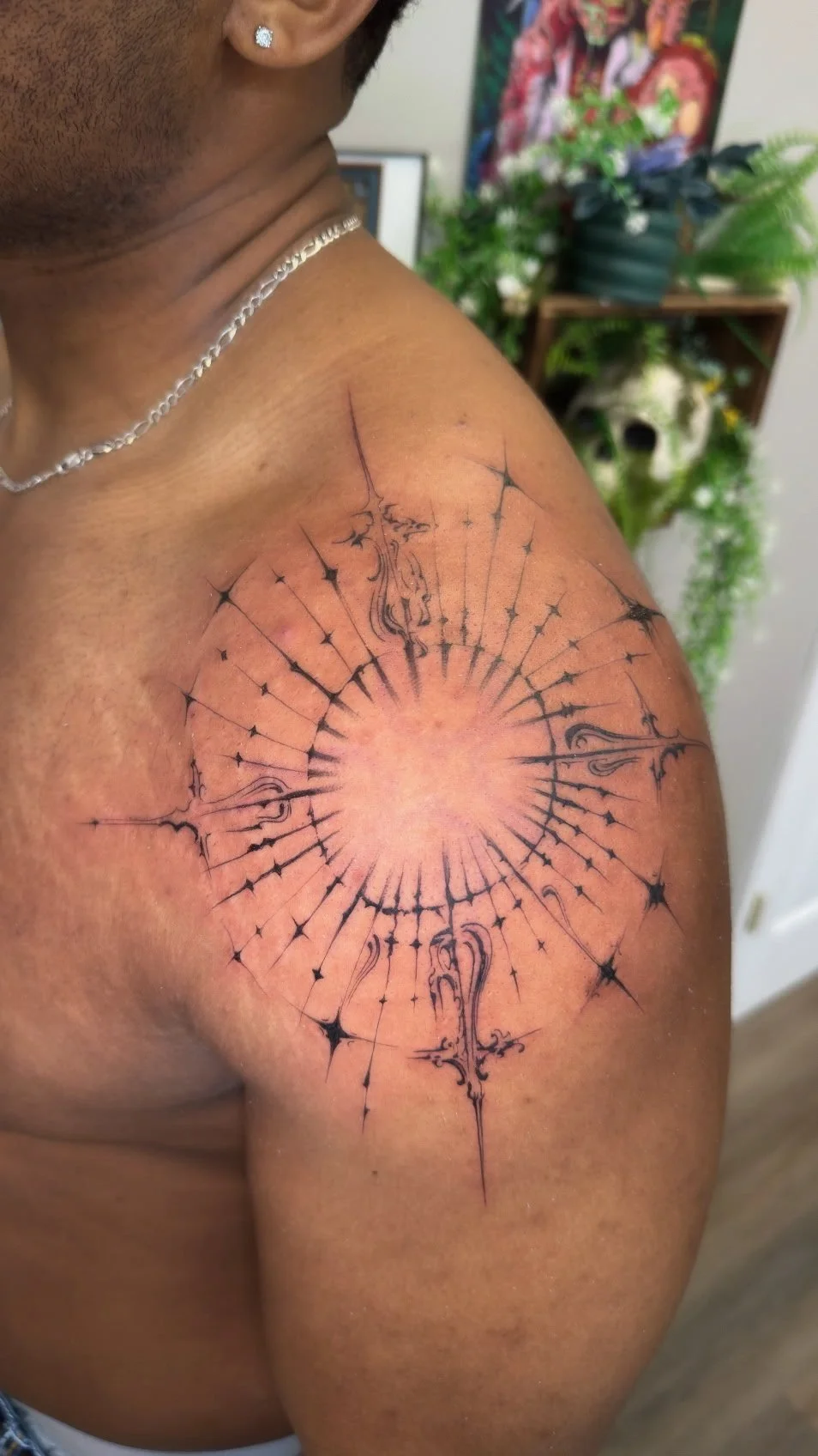 Fine line ornamental tattoo