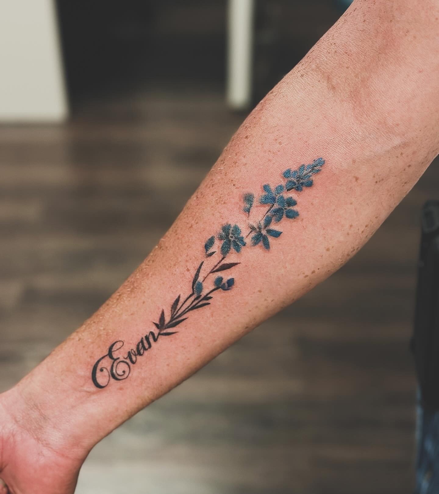 Fine line floral color tattoo