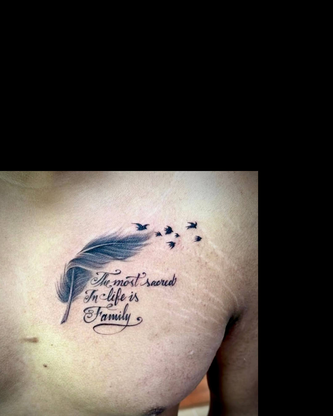 feather and quote tattoo