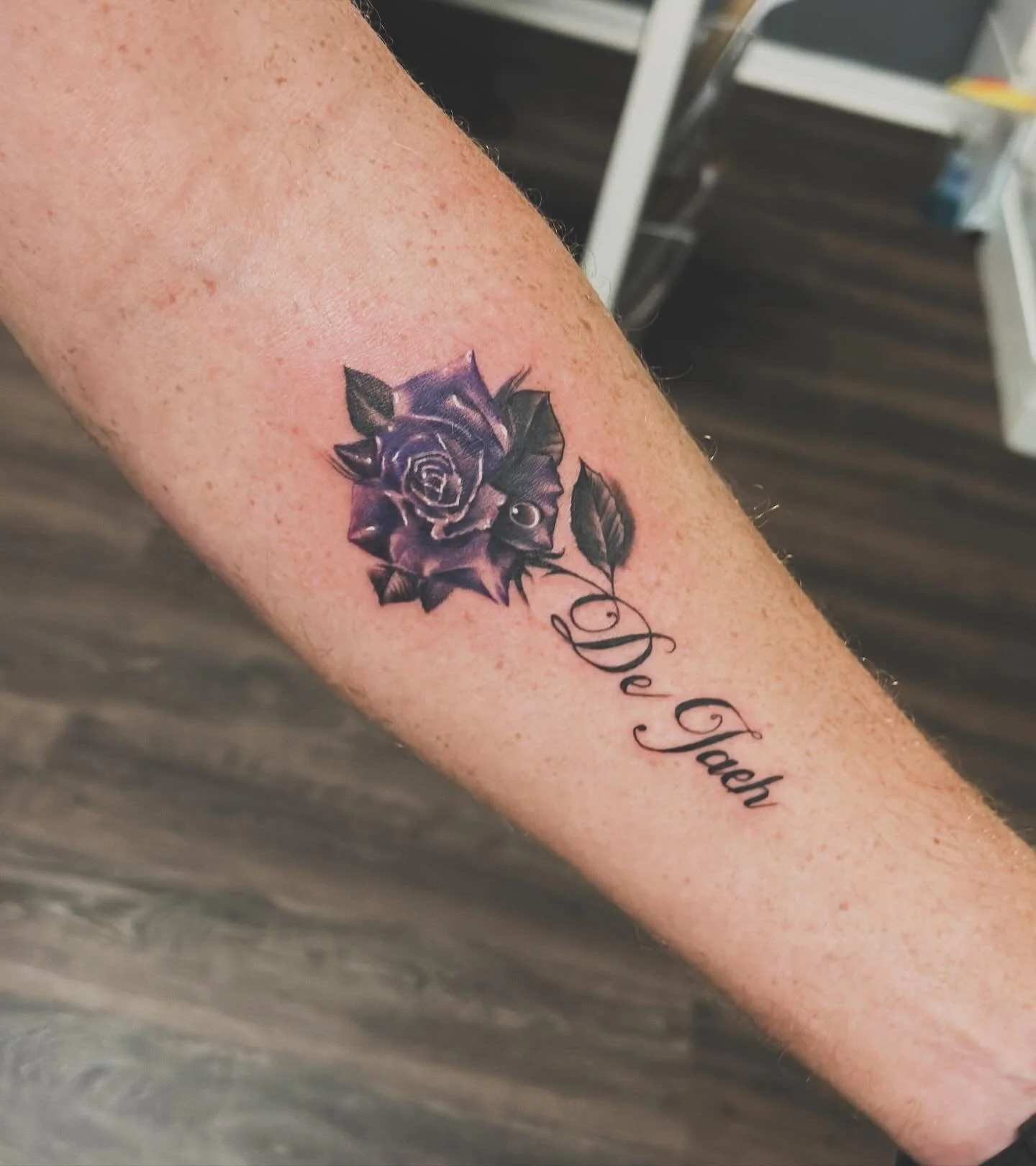 Fine line floral tattoo